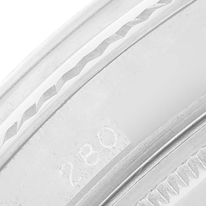 This close-up image shows the engraving detail on the bezel of a Rolex Datejust 1601 Men
s Stainless Steel Silver Dial 1601 Men
s Stainless Steel Silver Dial watch.