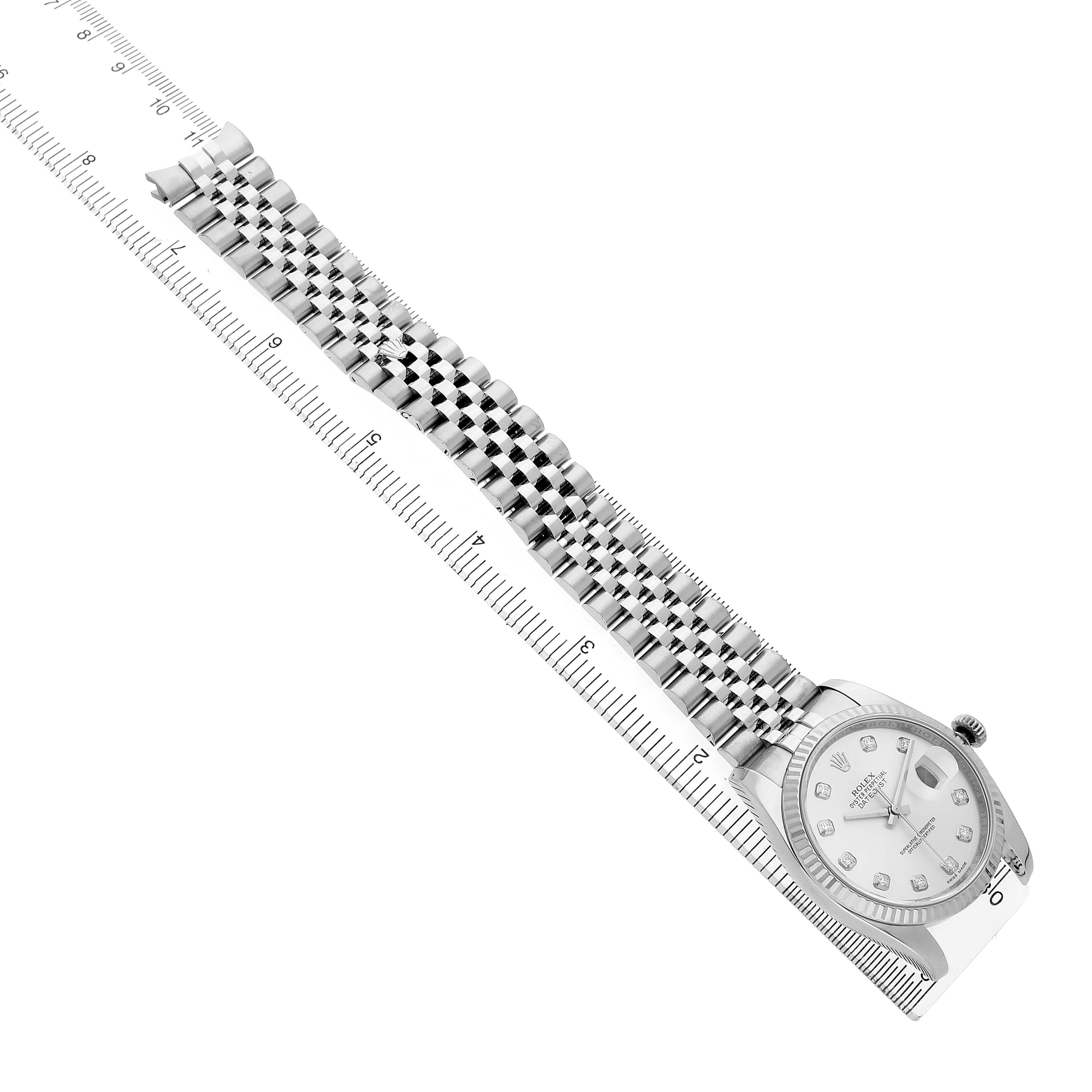The Rolex Datejust 116234 Men's Stainless Steel Silver Dial is shown diagonally with a focus on its bracelet, face, and a ruler for scale.
