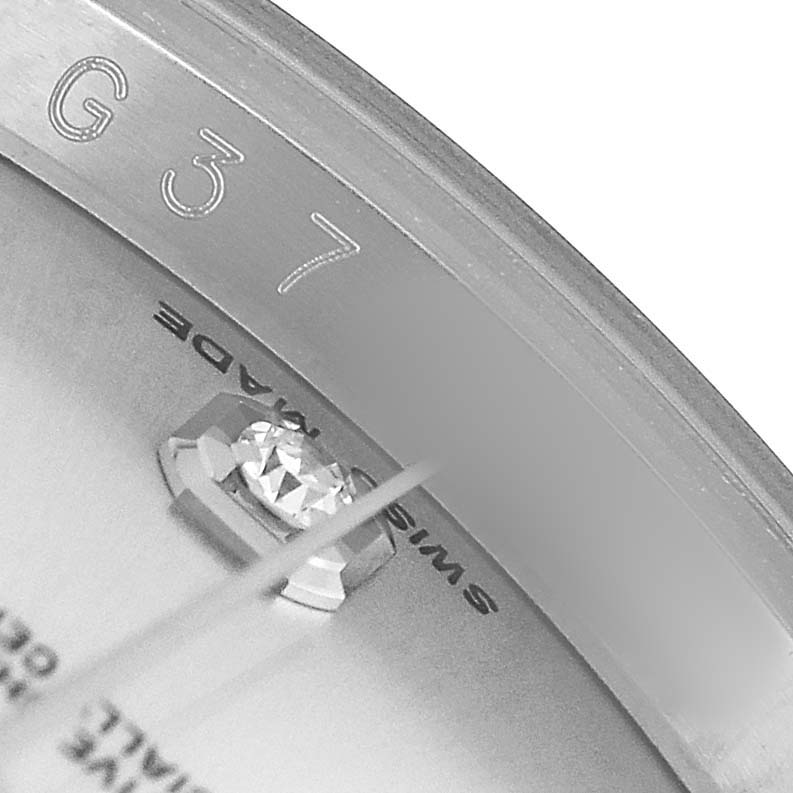 The image shows a close-up of the inner bezel and diamond marker of a Rolex Datejust 116234 Men's Stainless Steel Silver Dial.