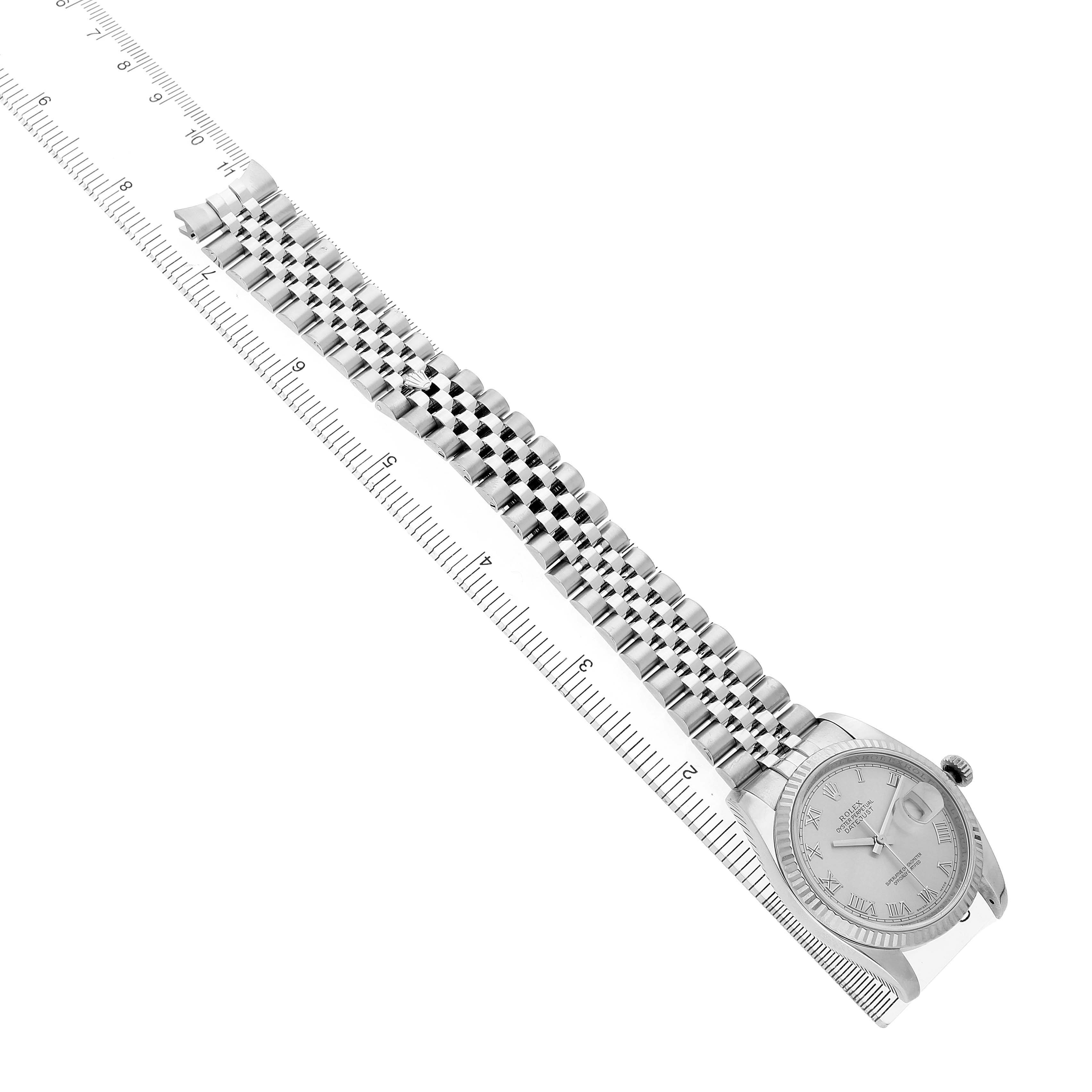 The Rolex Datejust 116234 Men's Stainless Steel White Dial watch is shown from a side angle, highlighting the dial, bezel, and full bracelet with a ruler for scale.