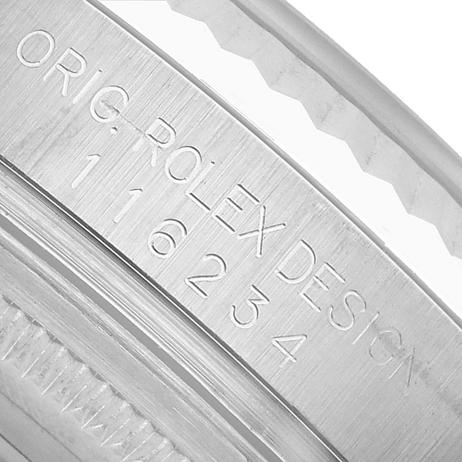 The image shows the engraved side of the bezel on a Rolex Datejust 116234 Men's Stainless Steel White Dial model.
