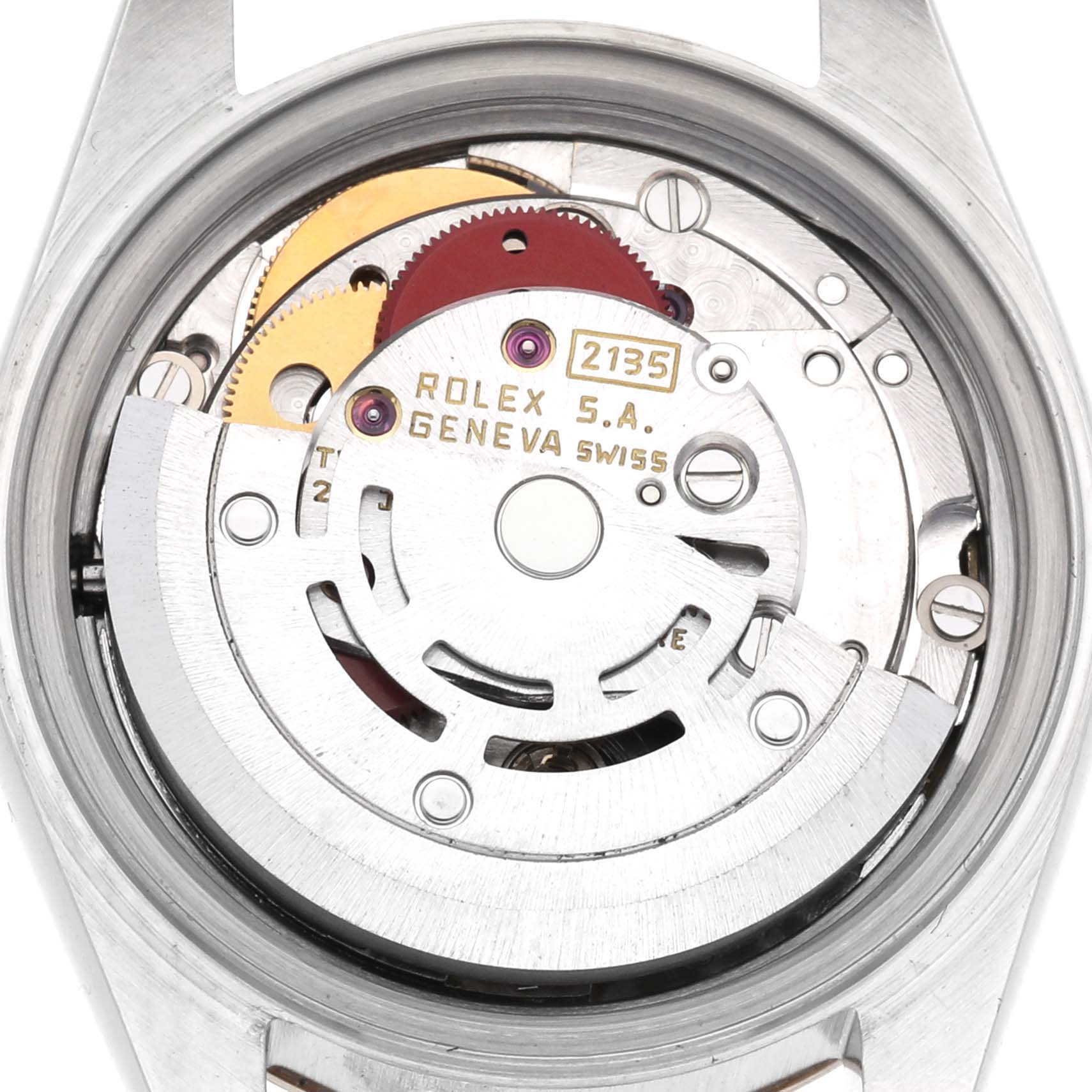 The image shows the movement of a Rolex Datejust 69173 Women
s Steel and Gold (two tone) Champagne Dial 69173 Women
s Steel and Gold (two tone) Champagne Dial watch from an inside angle, featuring gears and the rotor.