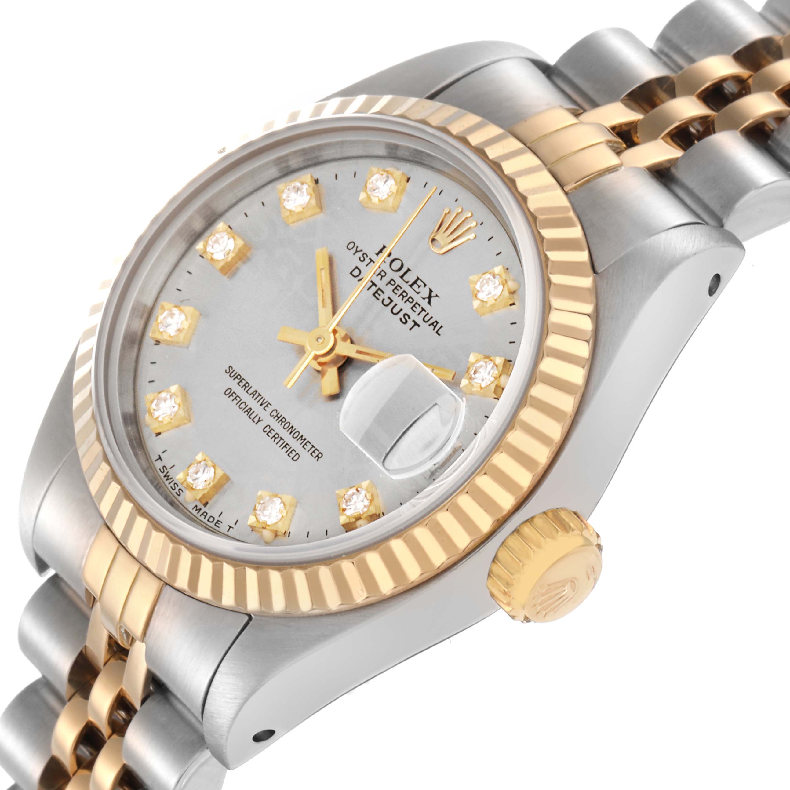 The Rolex Datejust 69173 Women
s Steel and Gold (two tone) Silver Dial 69173 Women
s Steel and Gold (two tone) Silver Dial watch is shown at an angle displaying the dial, diamond indices, fluted bezel, and part of the bracelet.