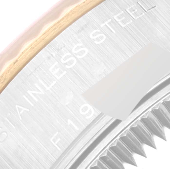 The image shows a close-up of the stainless steel and gold bezel and case back of a Rolex Datejust 79173 Women's Steel and Gold (two tone) Black Dial 79173 Women's Steel and Gold (two tone) Black Dial watch.