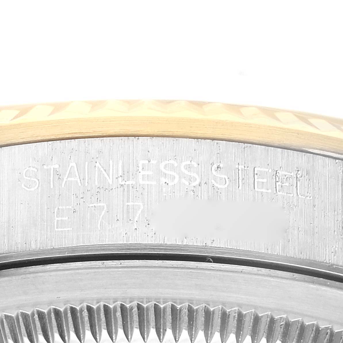 The image shows a close-up of the side of a Rolex Datejust 16233 Men's Steel and Gold (two tone) Black Dial 16233 Men's Steel and Gold (two tone) Black Dial watch, highlighting the stainless steel casing and part of the fluted bezel.