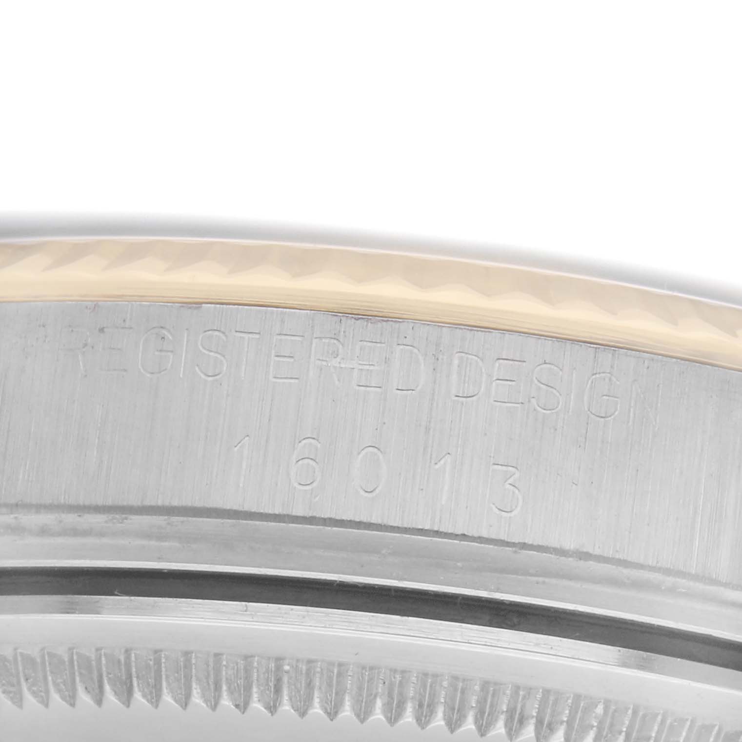 The image shows a close-up of the side engraving on a Rolex Vintage Collection 16013 Men
s Steel and Gold (two tone) Black Dial 16013 Men
s Steel and Gold (two tone) Black Dial watch, highlighting the model number.