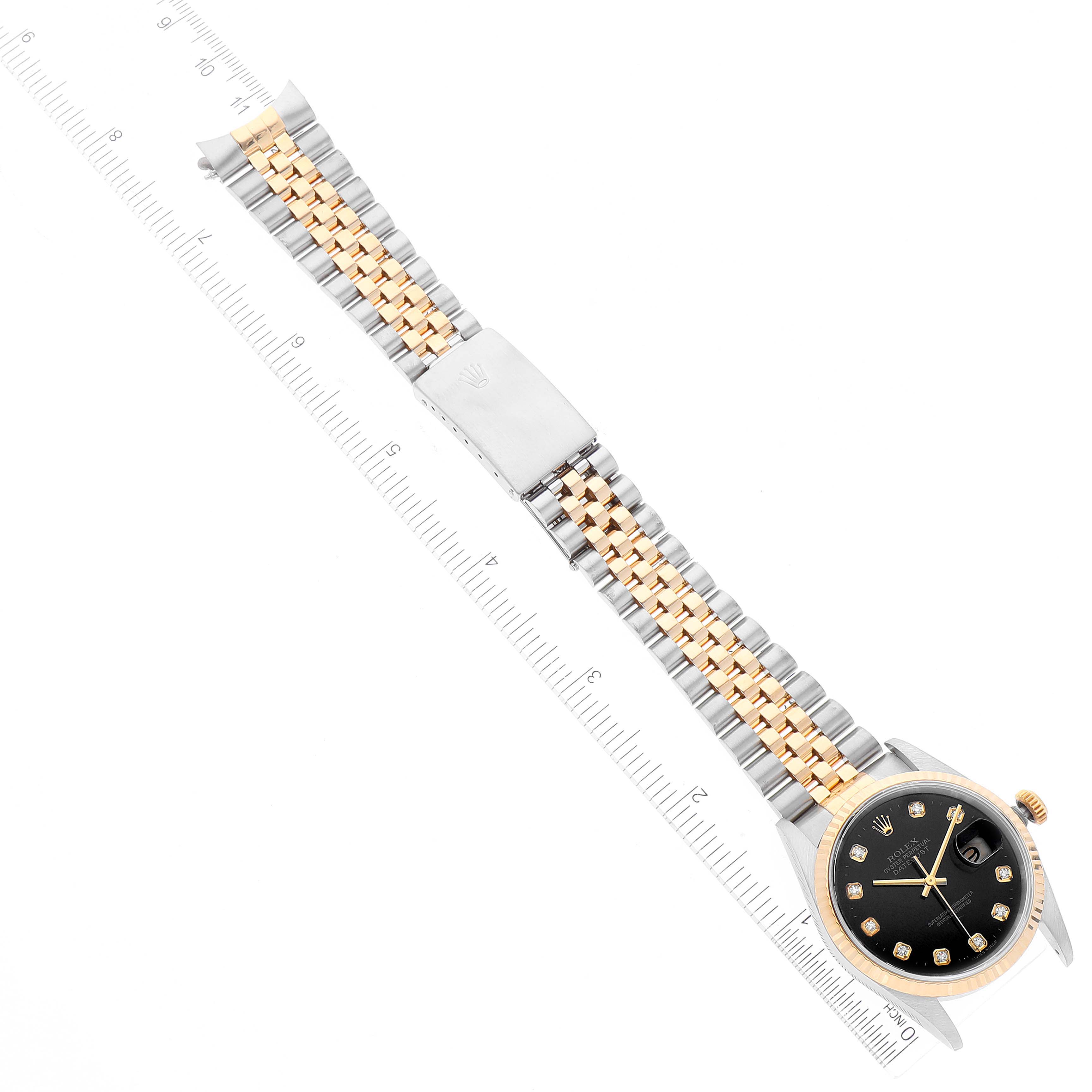 The Rolex Datejust 16233 Men's Steel and Gold (two tone) Black Dial 16233 Men's Steel and Gold (two tone) Black Dial watch is shown lying flat, displaying its face, bracelet, and clasp.