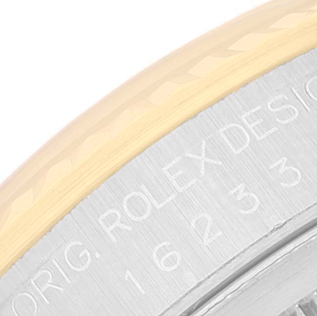 The image shows a close-up angle of the case back with the engraving of a Rolex Datejust 16233 Men's Steel and Gold (two tone) Black Dial 16233 Men's Steel and Gold (two tone) Black Dial watch model.