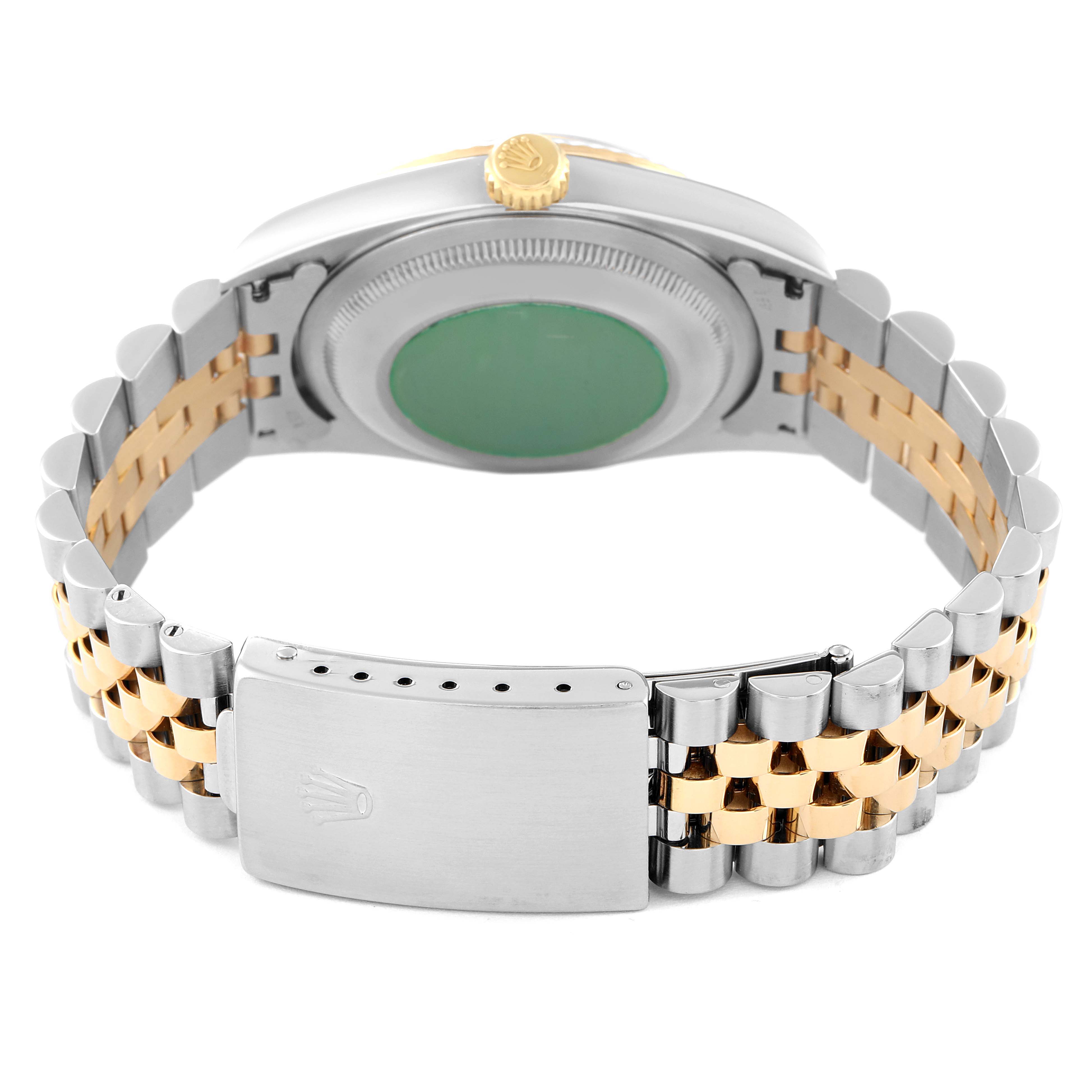 This image shows the bracelet and case back of a Rolex Datejust 16233 Men's Steel and Gold (two tone) Black Dial 16233 Men's Steel and Gold (two tone) Black Dial watch, featuring a two-tone Jubilee bracelet and a green case back sticker.