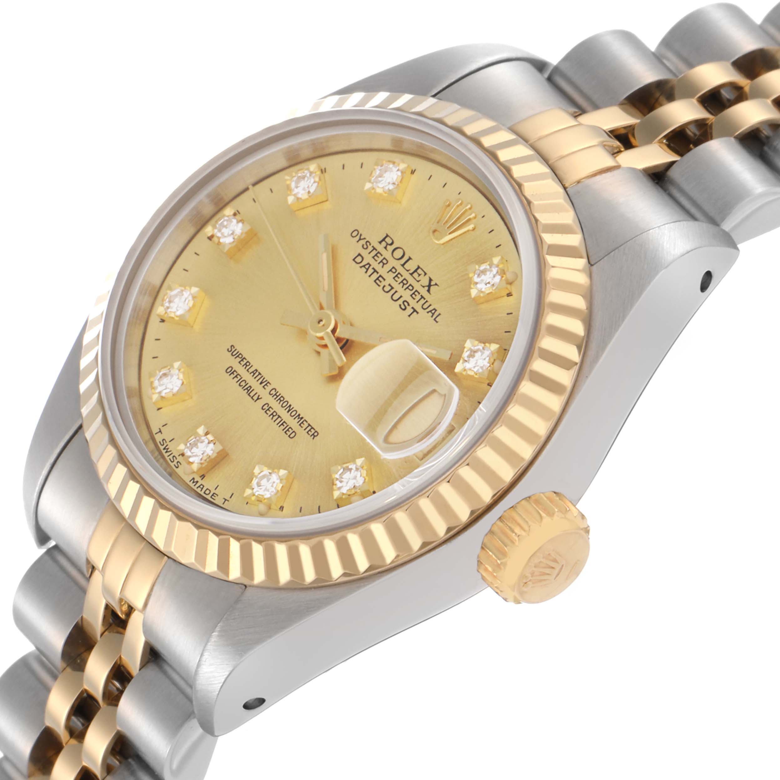The Rolex Datejust 69173 Women
s Steel and Gold (two tone) Champagne Dial 69173 Women
s Steel and Gold (two tone) Champagne Dial watch is shown from a slight side angle, highlighting its gold dial, fluted bezel, and Jubilee bracelet.