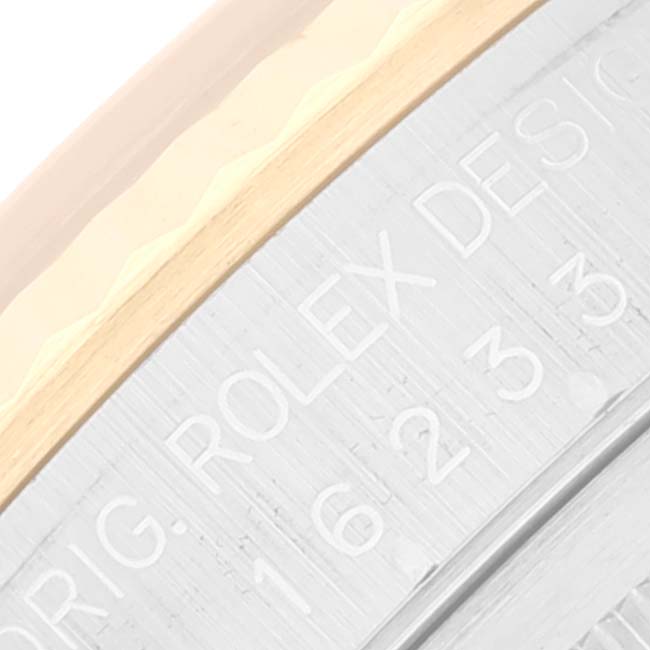 The image shows a close-up of the bezel and case edge of a Rolex Datejust 16233 Men's Steel and Gold (two tone) White Dial 16233 Men's Steel and Gold (two tone) White Dial watch.