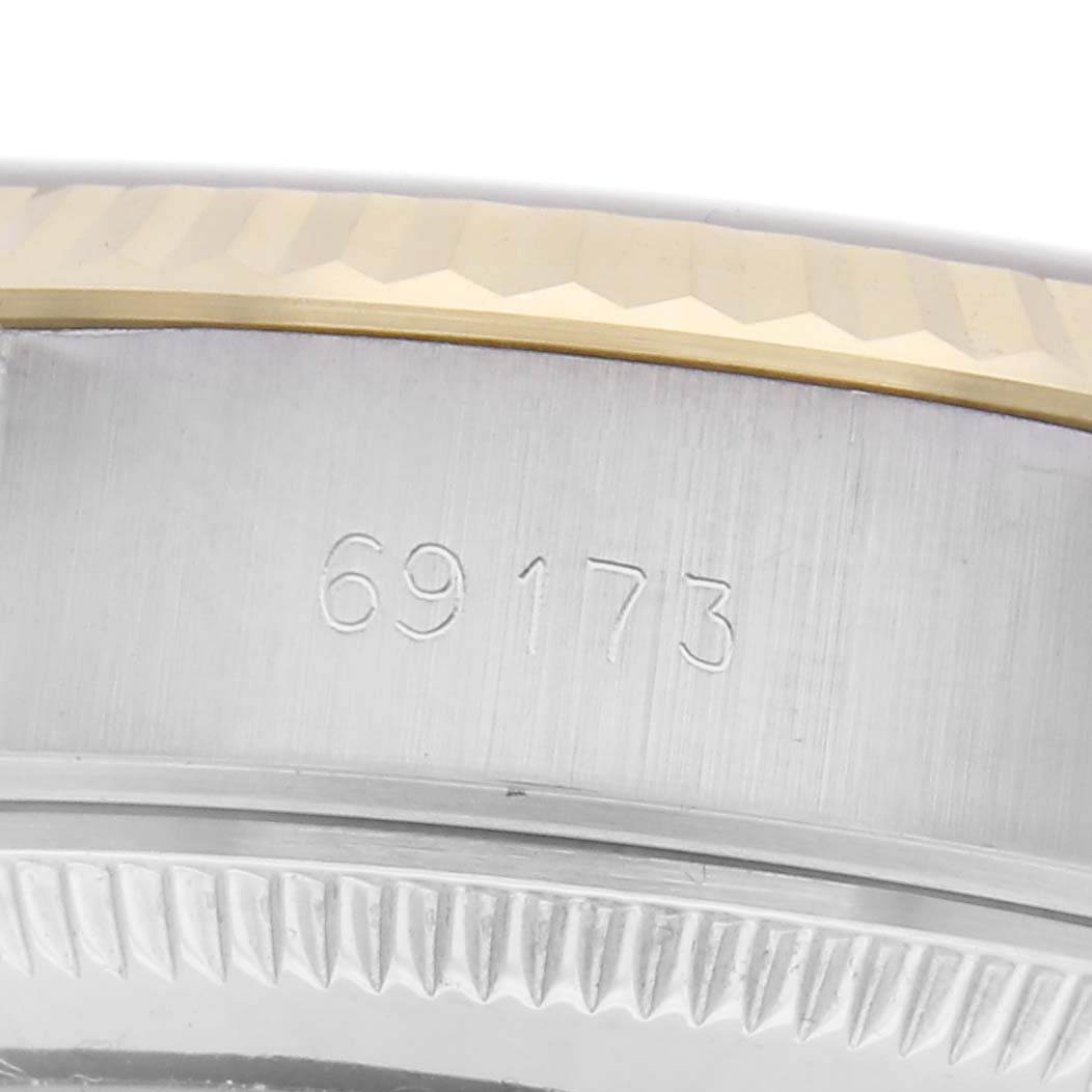 The image shows a close-up side view of the Rolex Datejust 69173 Women
s Steel and Gold (two tone) White Dial 69173 Women
s Steel and Gold (two tone) White Dial
s case, highlighting the model number "69173" and part of the bezel.