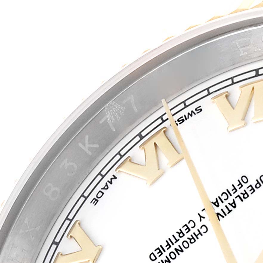 This image shows a close-up of the dial and part of the bezel of a Rolex Datejust 116233 Men's Steel and Gold (two tone) White Dial 116233 Men's Steel and Gold (two tone) White Dial watch.
