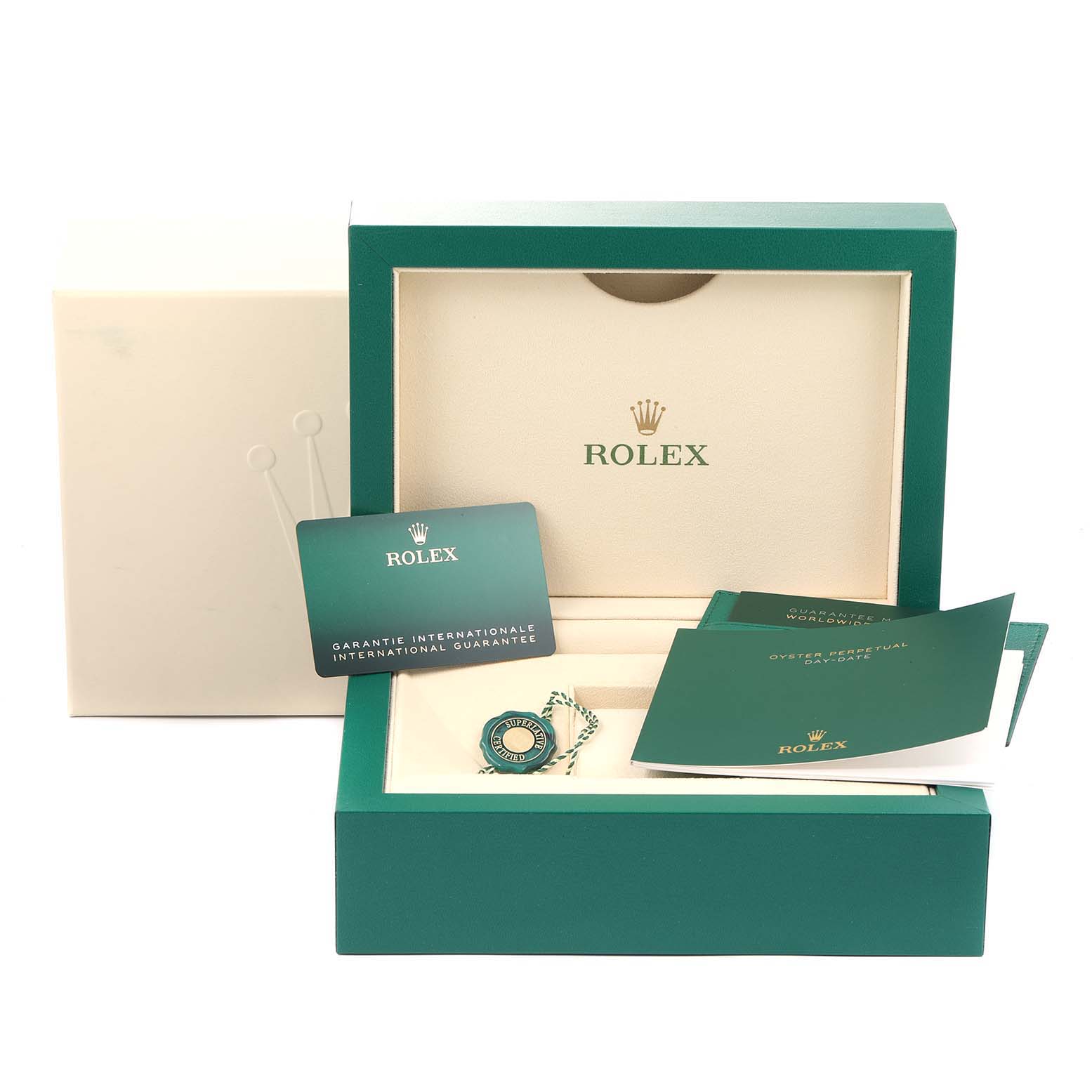 The image shows the packaging of a Rolex President 228235 Men's Rose Gold Pink Dial 228235 Men's Rose Gold Pink Dial model watch, including the branded box, warranty card, manuals, and tags.