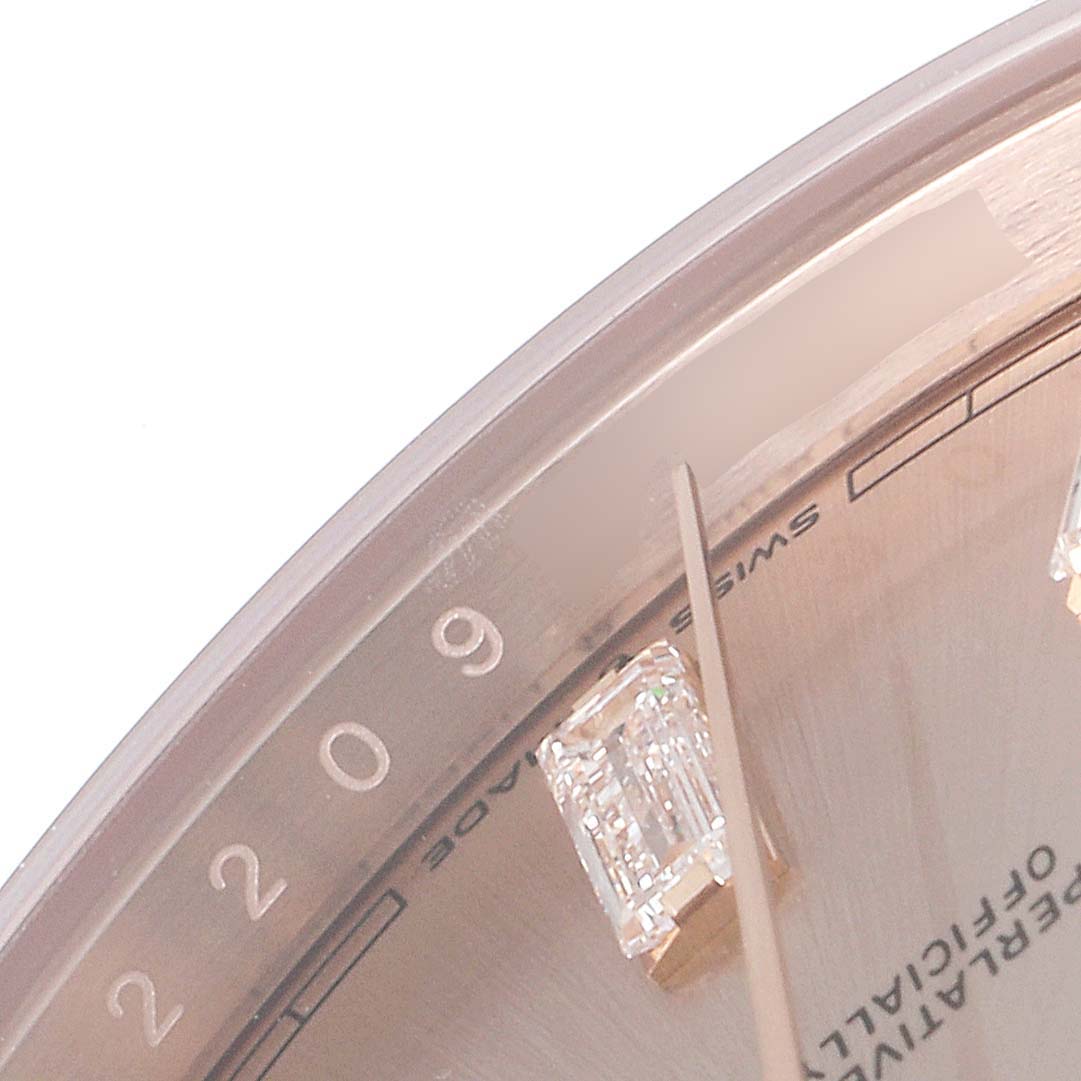 The image shows a close-up of the dial of a Rolex President 228235 Men's Rose Gold Pink Dial 228235 Men's Rose Gold Pink Dial model watch, focusing on the hour marker, hands, and part of the chapter ring.