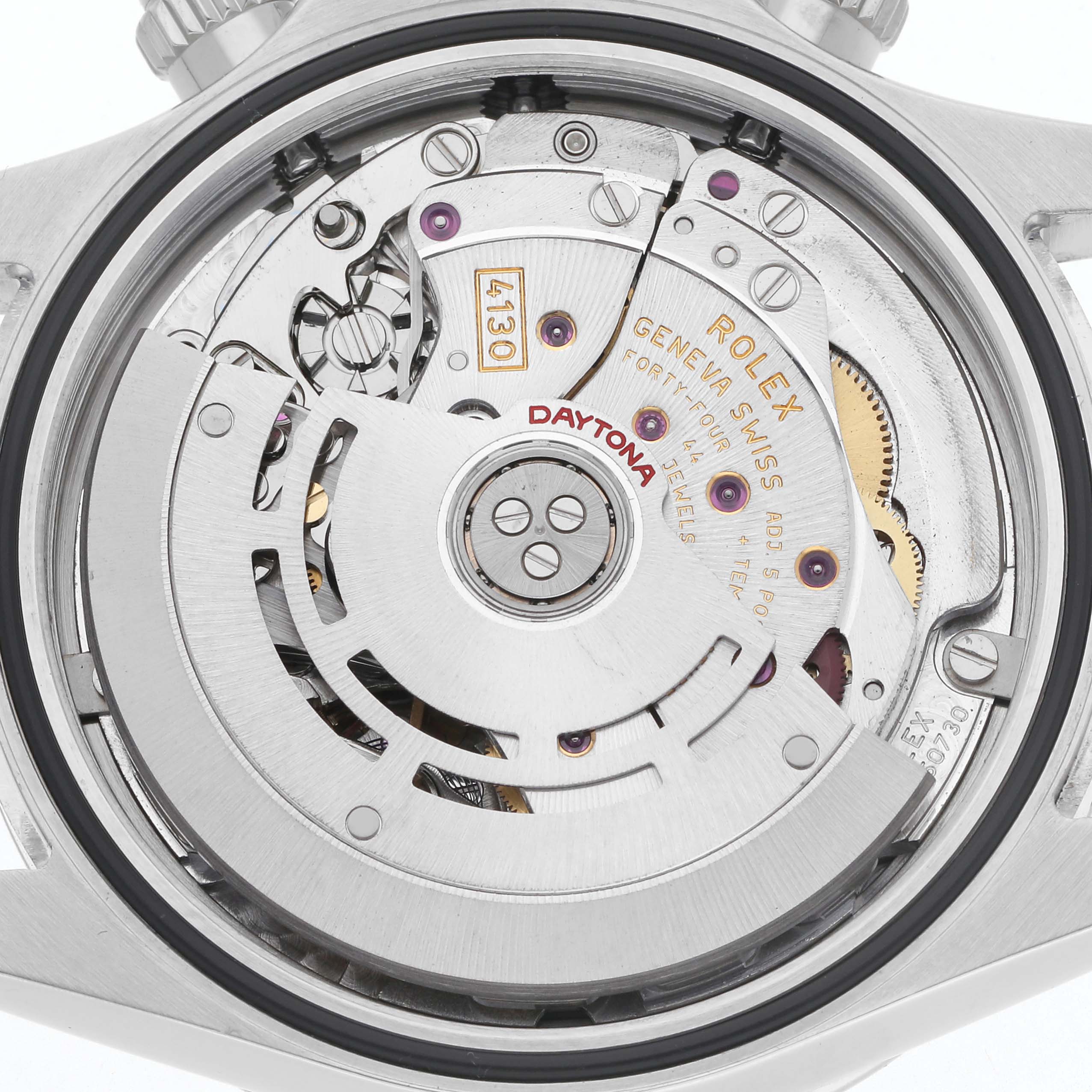 The image shows the movement of a Rolex Daytona 116520 Men
s Stainless Steel White Dial 116520 Men
s Stainless Steel White Dial watch from the back, highlighting the rotor and mechanical components.