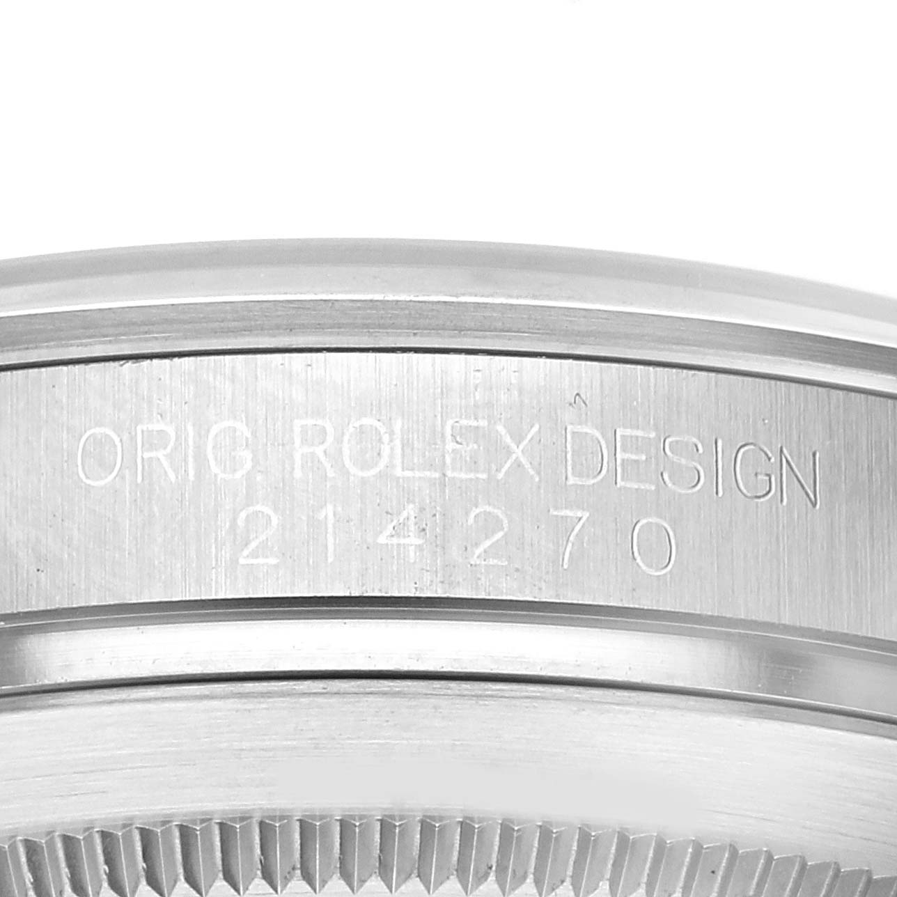 The image shows a close-up of the Rolex Explorer 214270 Men
s Stainless Steel Black Dial 214270 Men
s Stainless Steel Black Dial model 214270, focusing on the bezel and the engraved serial number.