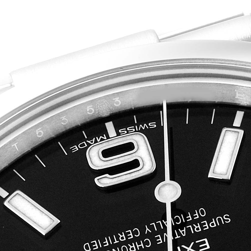 This image shows a partial close-up view of the dial and bezel of a Rolex Explorer 214270 Men
s Stainless Steel Black Dial 214270 Men
s Stainless Steel Black Dial watch.