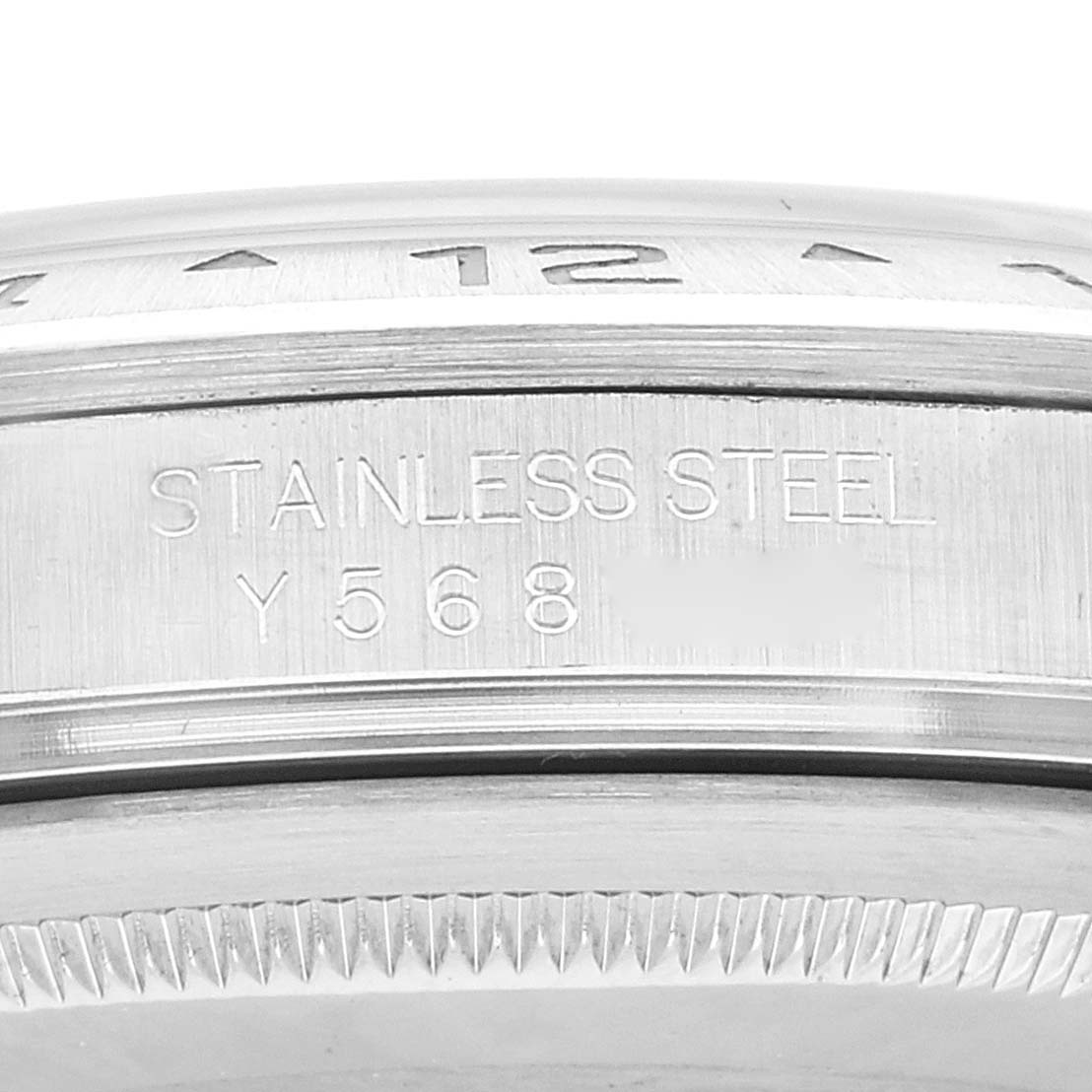 The image shows a close-up of the stainless steel case side of the Rolex Explorer 16570 Men's Stainless Steel White Dial 16570 Men's Stainless Steel White Dial watch, including part of the bezel and case engraving.