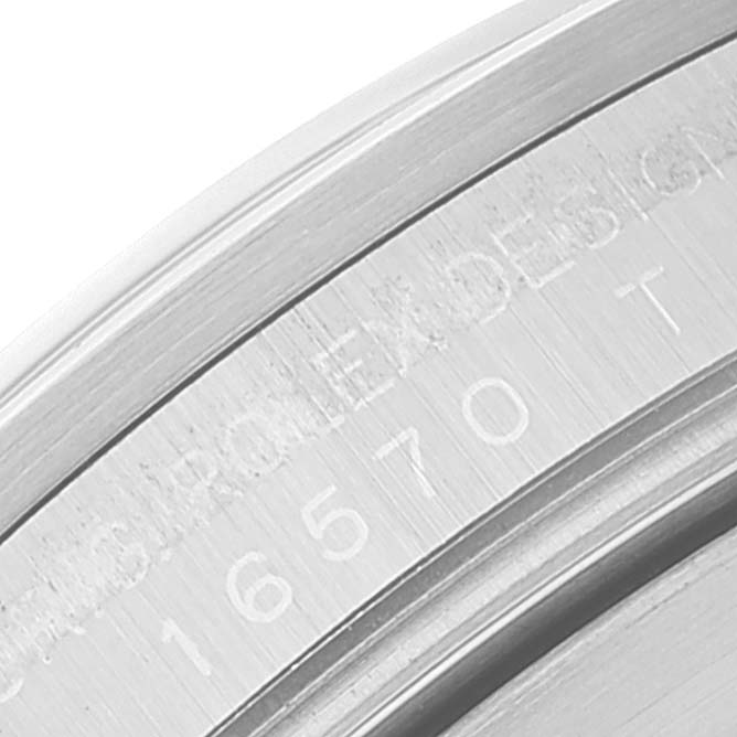 This image shows a close-up of the edge and engraved serial number on the case back of a Rolex Explorer 16570 Men's Stainless Steel White Dial 16570 Men's Stainless Steel White Dial watch.