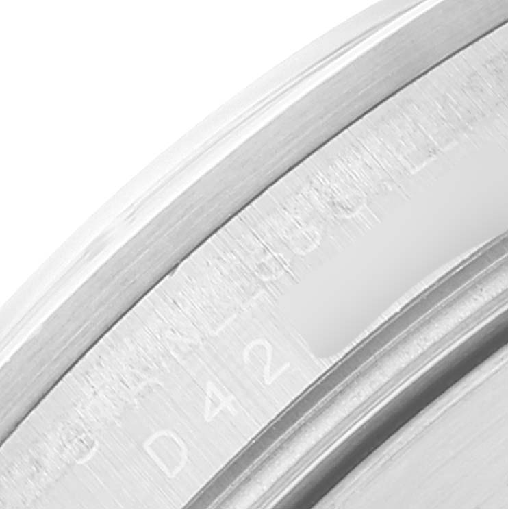This close-up image shows part of the casing and serial number of the Rolex Explorer 16570 Men's Stainless Steel White Dial 16570 Men's Stainless Steel White Dial model.