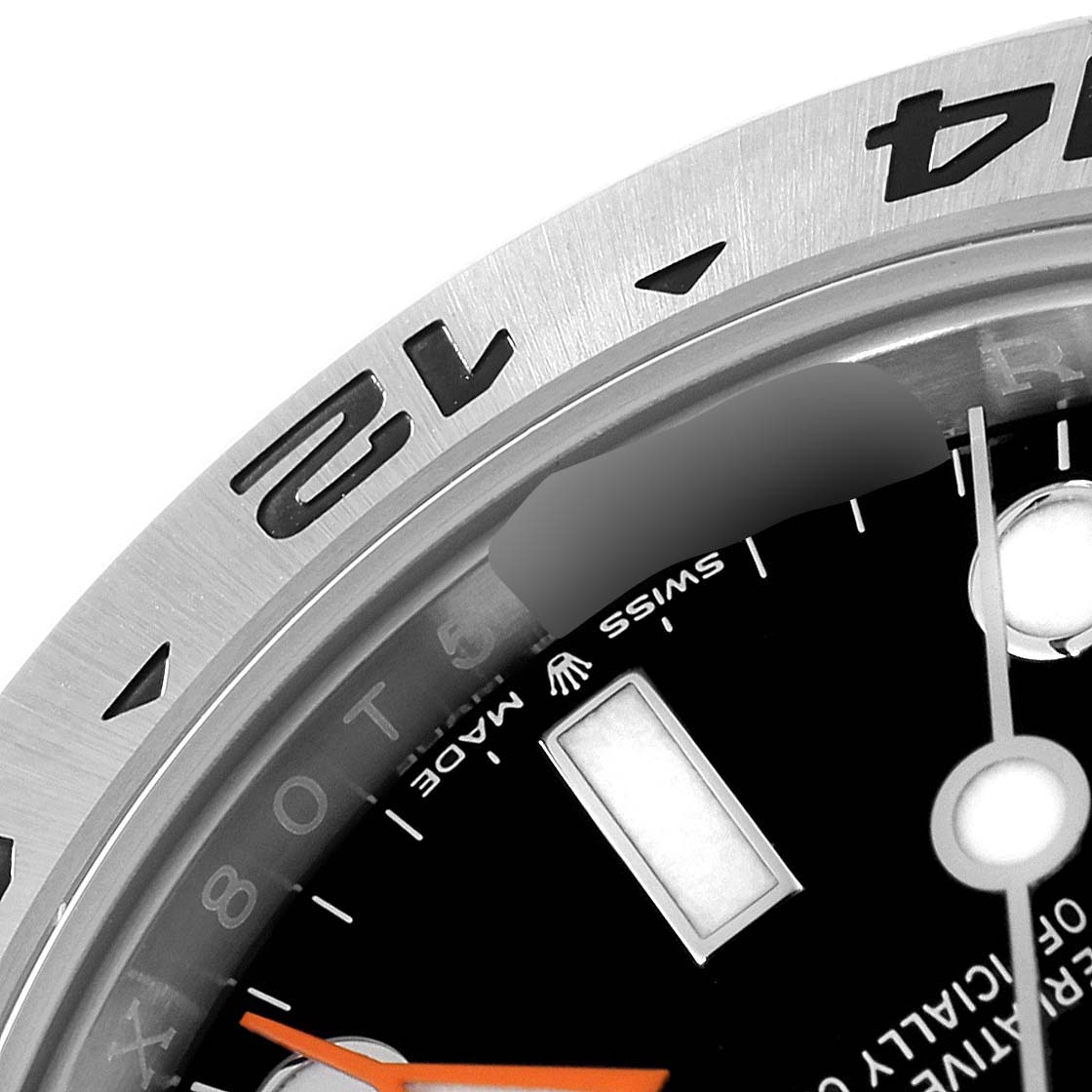 The image shows a close-up of the bezel, dial, and part of the orange hand of a Rolex Explorer 226570 Men
s Stainless Steel Black Dial 226570 Men
s Stainless Steel Black Dial watch.