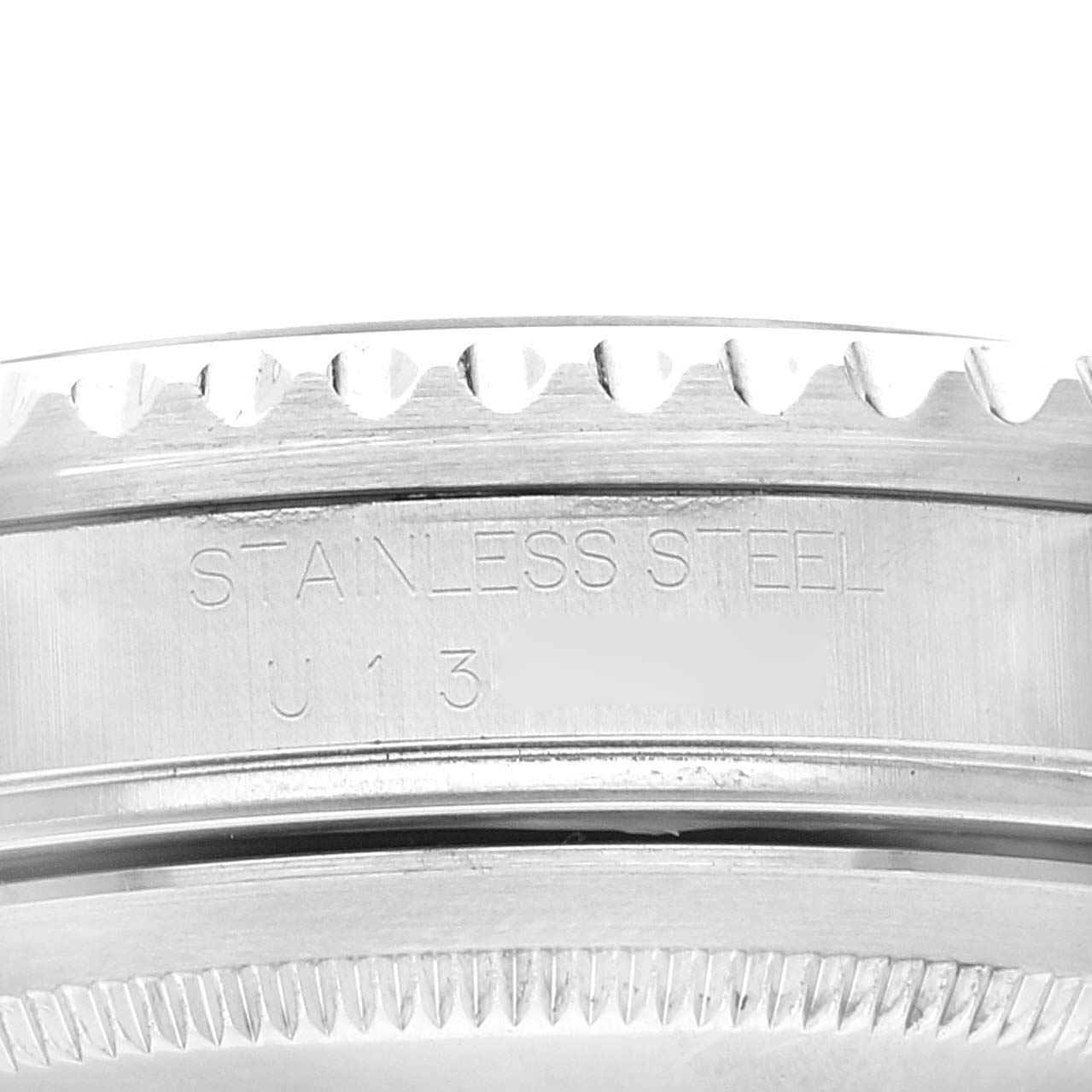Close-up of the side of the stainless steel casing showing engravings on the Rolex GMT-Master 16710 Men's Stainless Steel Black Dial 16710 Men's Stainless Steel Black Dial watch.