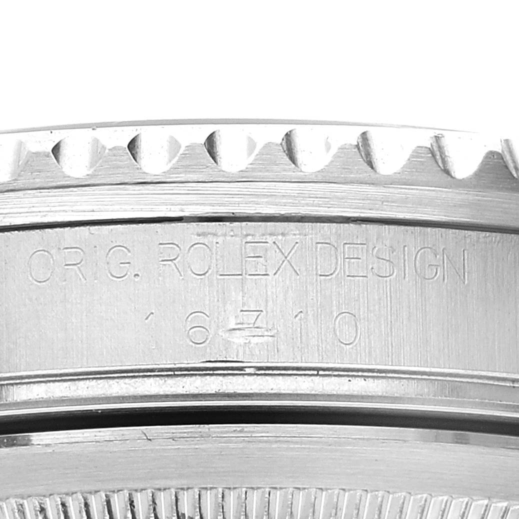 The image shows a close-up of the bezel and case side, with the "ORIG. ROLEX DESIGN" engraving of a Rolex GMT-Master 16710 Men's Stainless Steel Black Dial 16710 Men's Stainless Steel Black Dial model.