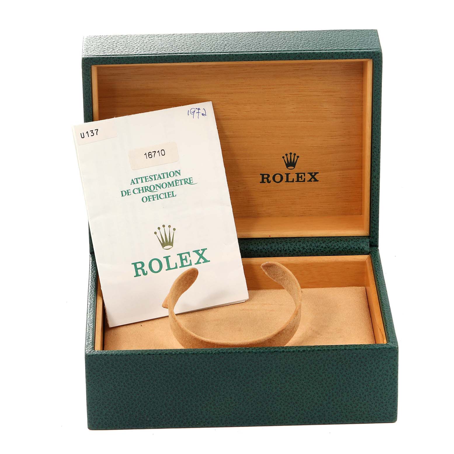 The image shows an open Rolex GMT-Master 16710 Men's Stainless Steel Black Dial 16710 Men's Stainless Steel Black Dial green watch box with its certificate and a display cushion.