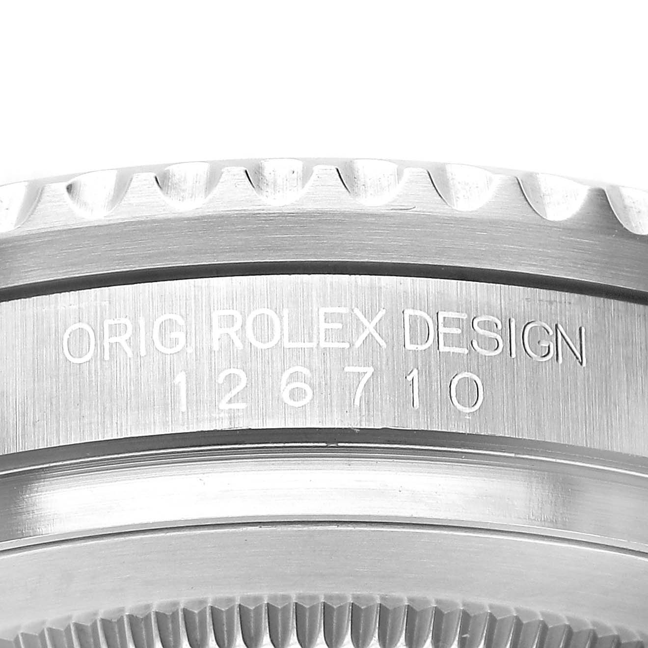 The image shows a close-up of the side of the Rolex GMT-Master M126710BLNR-0003 Men's Stainless Steel Black Dial, featuring the engraved model number and bezel details.