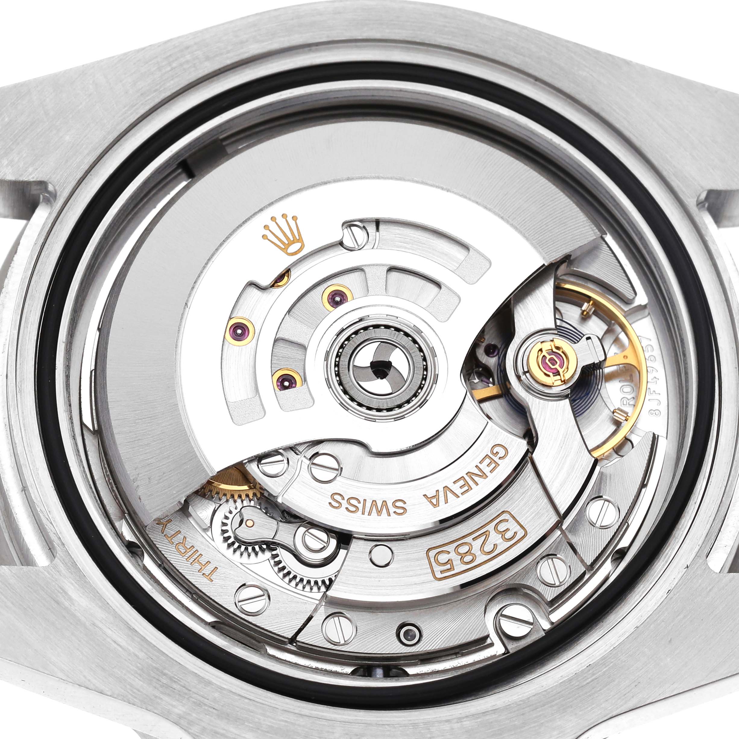 The image shows the open case back of a Rolex GMT-Master M126710BLNR-0003 Men's Stainless Steel Black Dial, highlighting its internal movement mechanism.