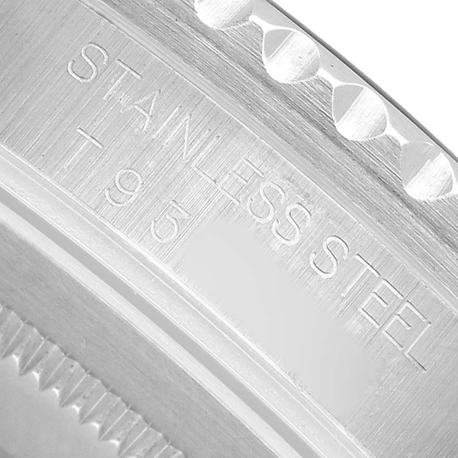 The image shows a close-up of the engraved stainless steel part of a Rolex Yacht-Master 16700 Men's Stainless Steel Black Dial watch.