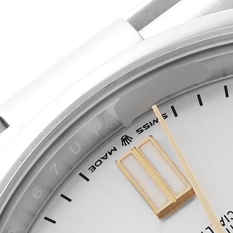 The image shows a partial close-up of the dial and bezel of a Rolex Oyster Perpetual 124300 Men's Stainless Steel Silver Dial 124300 Men's Stainless Steel Silver Dial watch, highlighting the "Swiss Made" text.