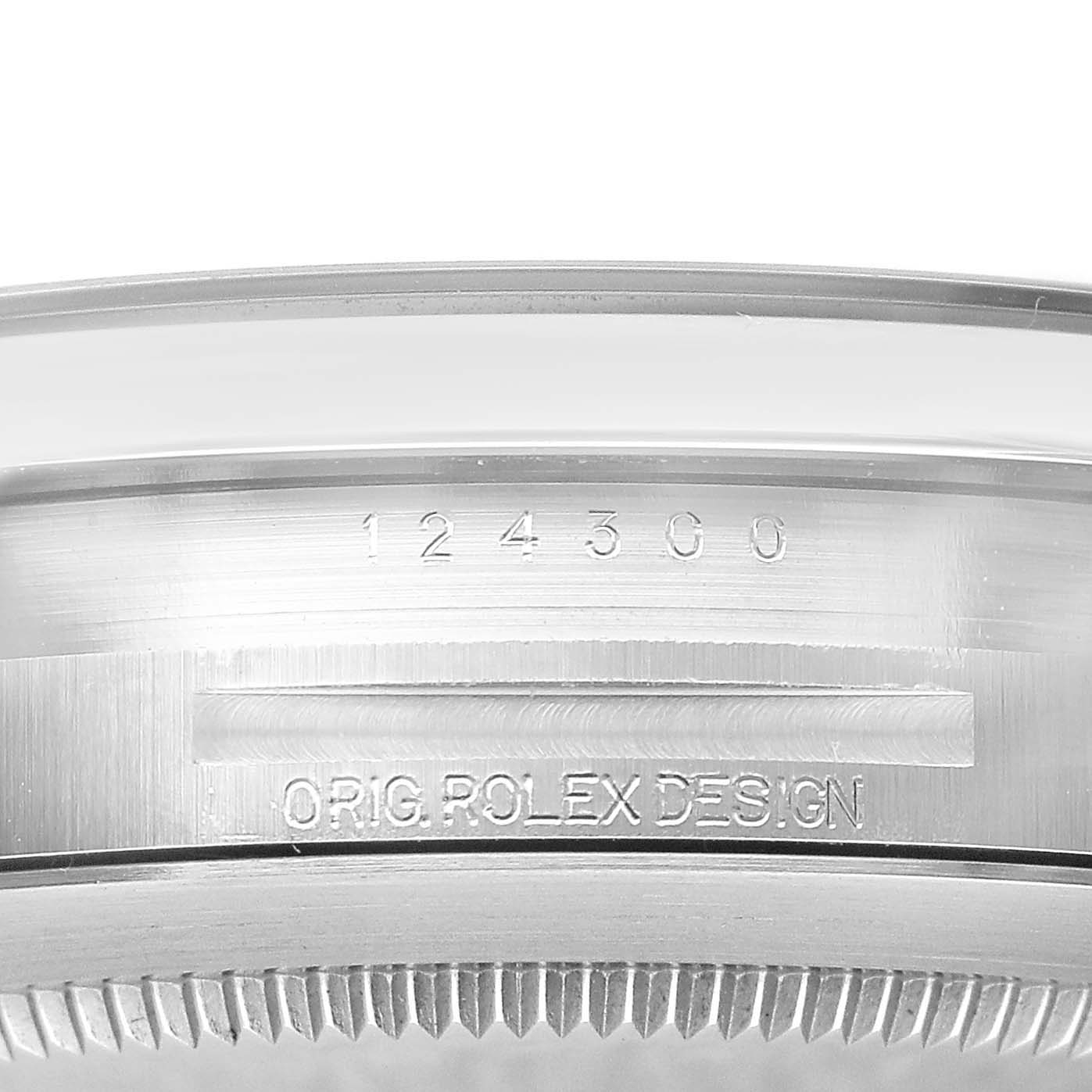 The image shows the side view of the Rolex Oyster Perpetual M124300-0002 Men's Stainless Steel Black Dial, highlighting the engraved model number and design details on the case.
