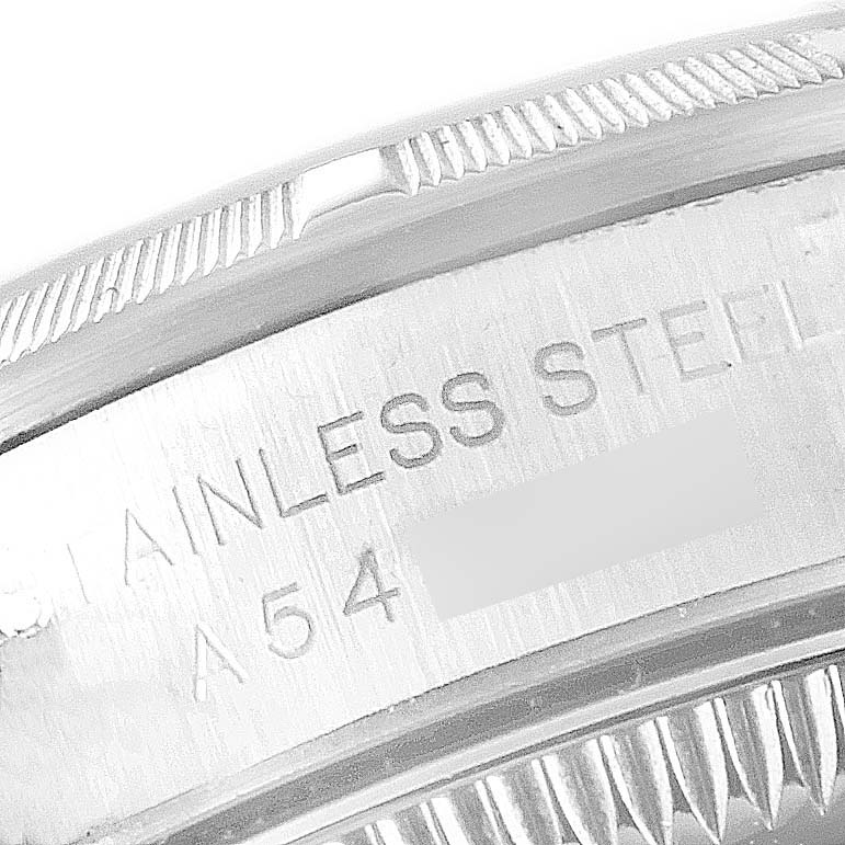 This close-up image shows the case back and part of the bezel of a Rolex Oyster Perpetual 76030 Women's Stainless Steel White Dial 76030 Women's Stainless Steel White Dial watch.