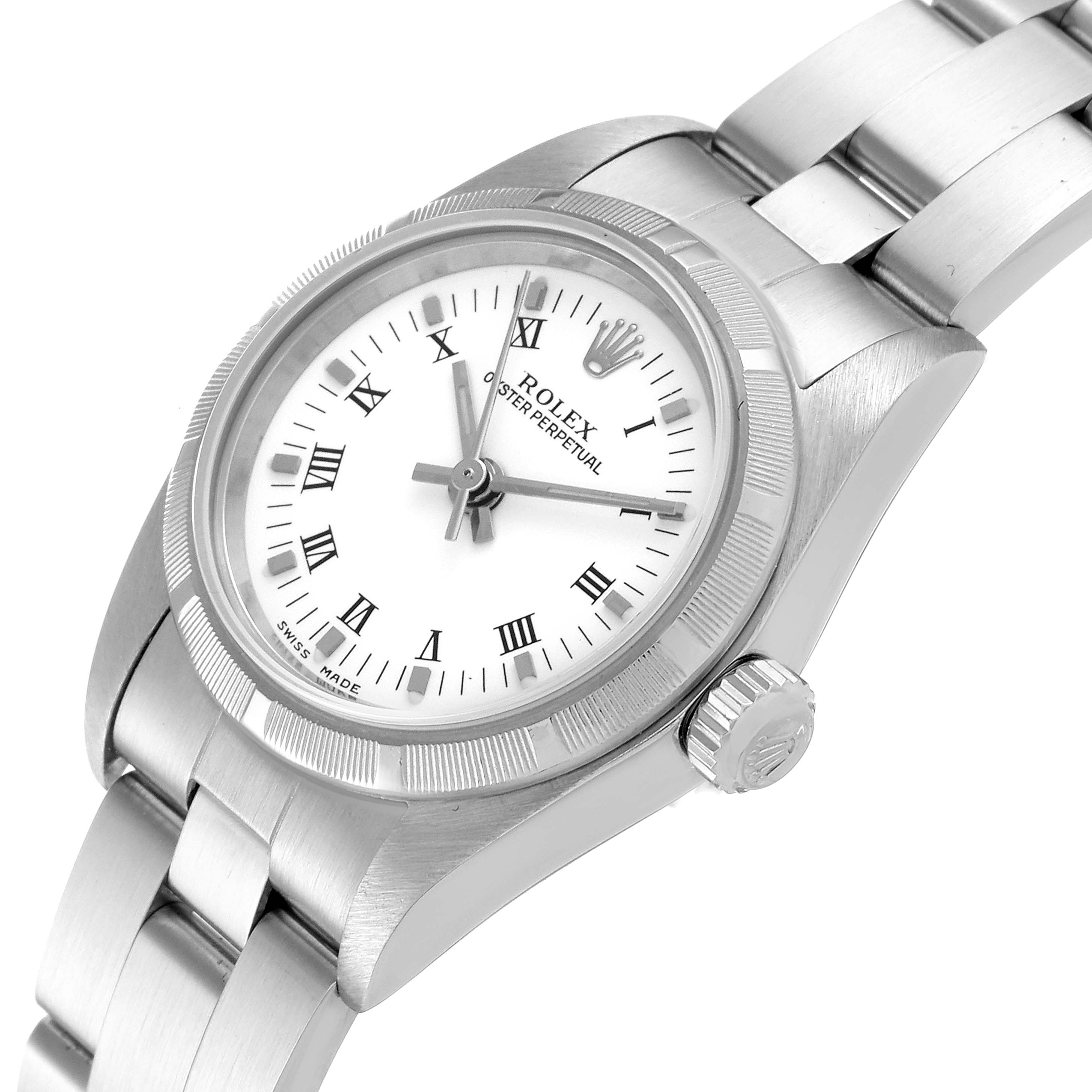 The Rolex Oyster Perpetual 76030 Women's Stainless Steel White Dial 76030 Women's Stainless Steel White Dial watch is shown at an angled view, displaying the dial, bezel, crown, and part of the bracelet.