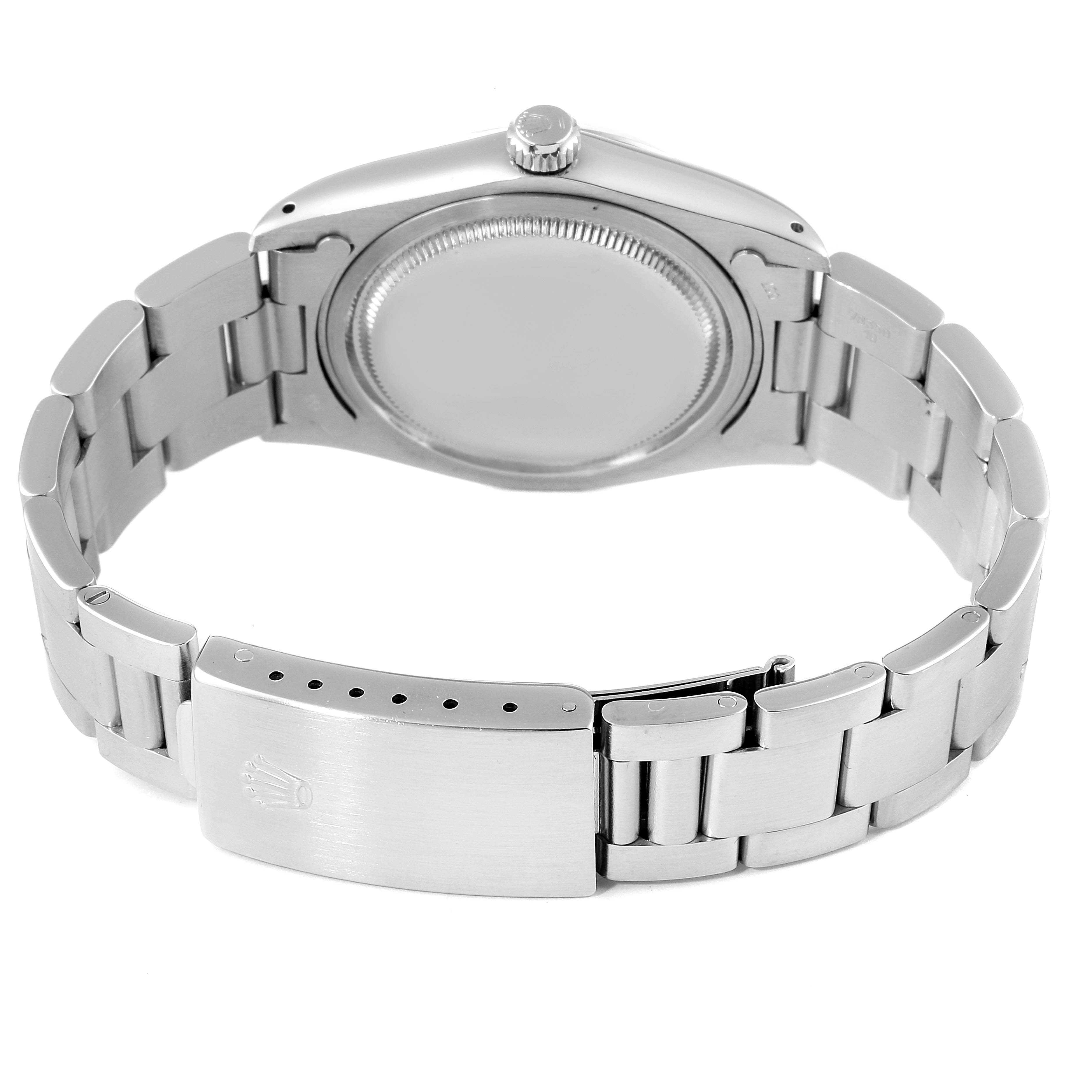 The image shows the back case, crown, and bracelet clasp of a Rolex Vintage Collection 6694 Men's Stainless Steel Silver Dial 6694 Men's Stainless Steel Silver Dial watch.