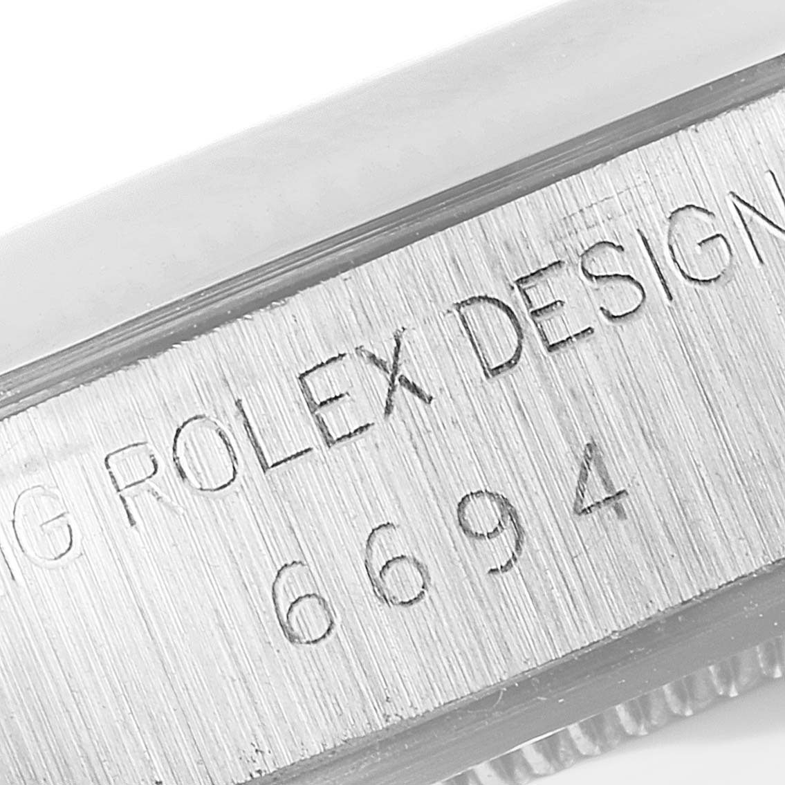 This close-up shows the engravings on the side of a Vintage Collection Rolex model 6694.
