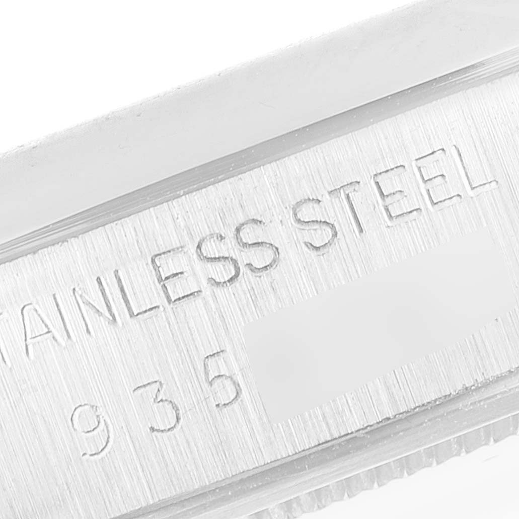 This is a close-up of the side of a Rolex Vintage Collection 6694 Men's Stainless Steel Silver Dial 6694 Men's Stainless Steel Silver Dial watch, showing the "STAINLESS STEEL" engraving on the case.