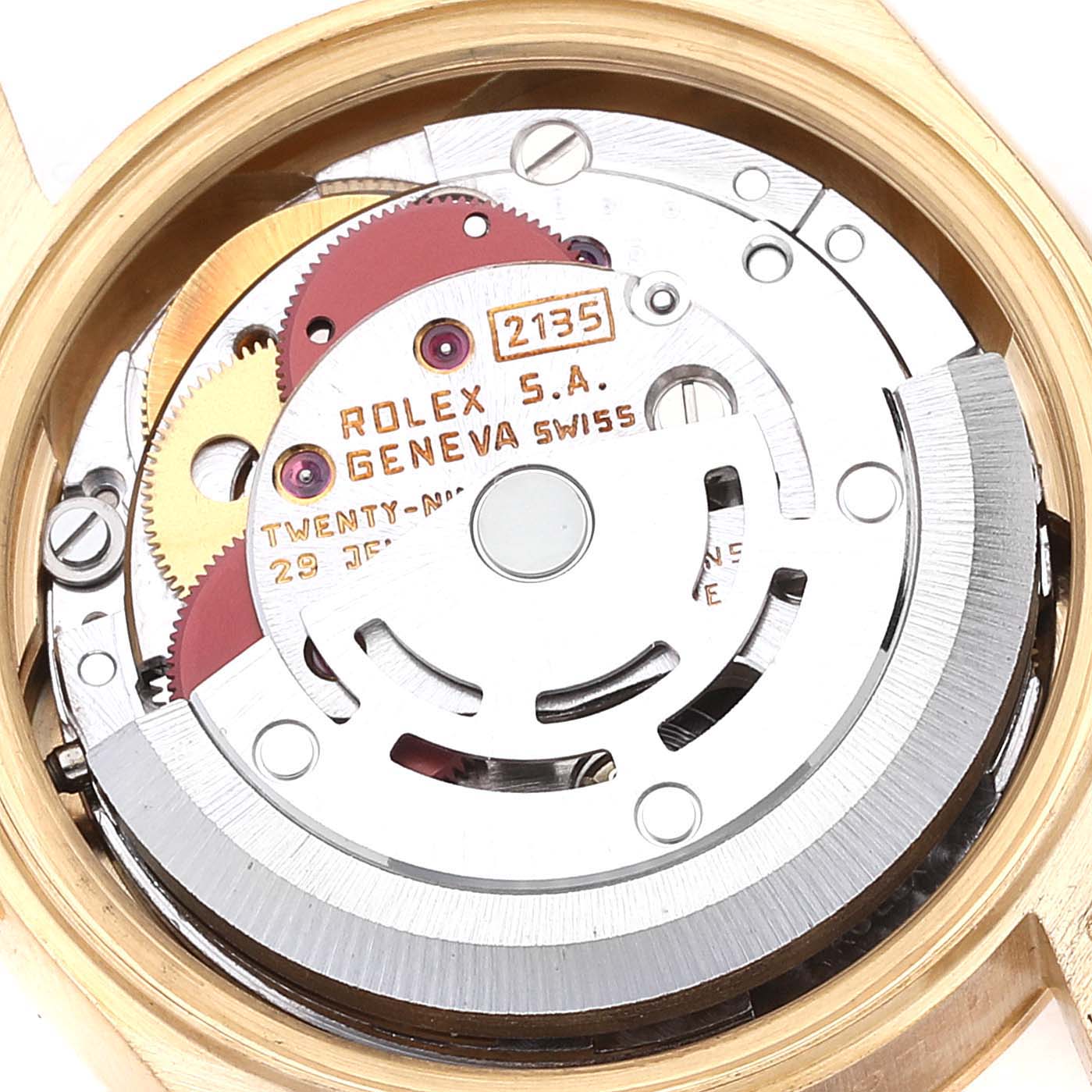 This image shows a close-up of the movement mechanism of a Rolex President 69178 Women
s Yellow Gold Champagne Dial 69178 Women
s Yellow Gold Champagne Dial model watch, highlighting the gears and engravings.