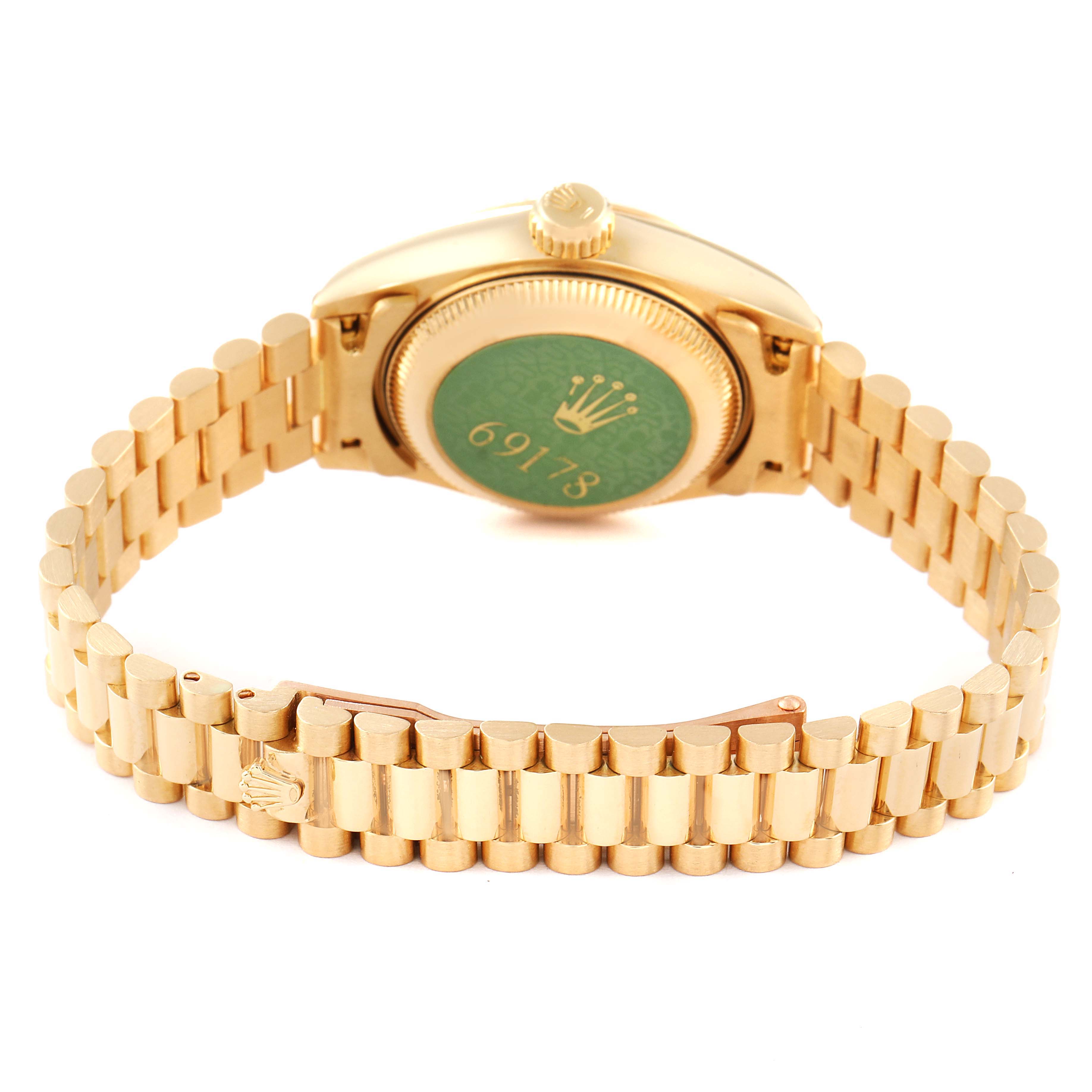 The image shows the back of a Rolex President 69178 Women
s Yellow Gold Champagne Dial 69178 Women
s Yellow Gold Champagne Dial model watch, focusing on the case back and the gold bracelet.