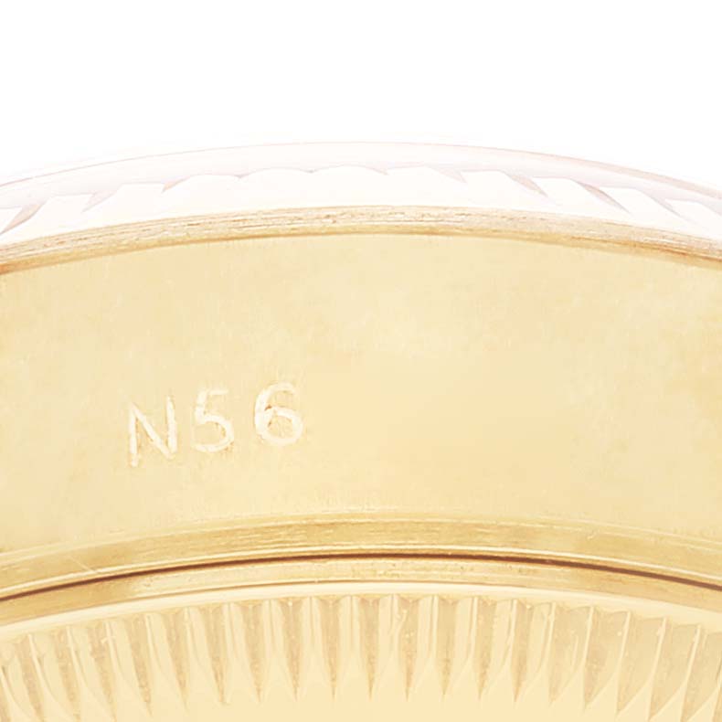 This image shows a close-up of the side of a Rolex President 69178 Women
s Yellow Gold Champagne Dial 69178 Women
s Yellow Gold Champagne Dial model watch, highlighting its fluted bezel and engraved reference number.