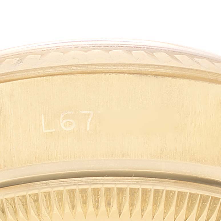 The image shows a close-up of the bezel and edge of the dial case of a Rolex President 69178 Women
s Yellow Gold Champagne Dial 69178 Women
s Yellow Gold Champagne Dial model watch.