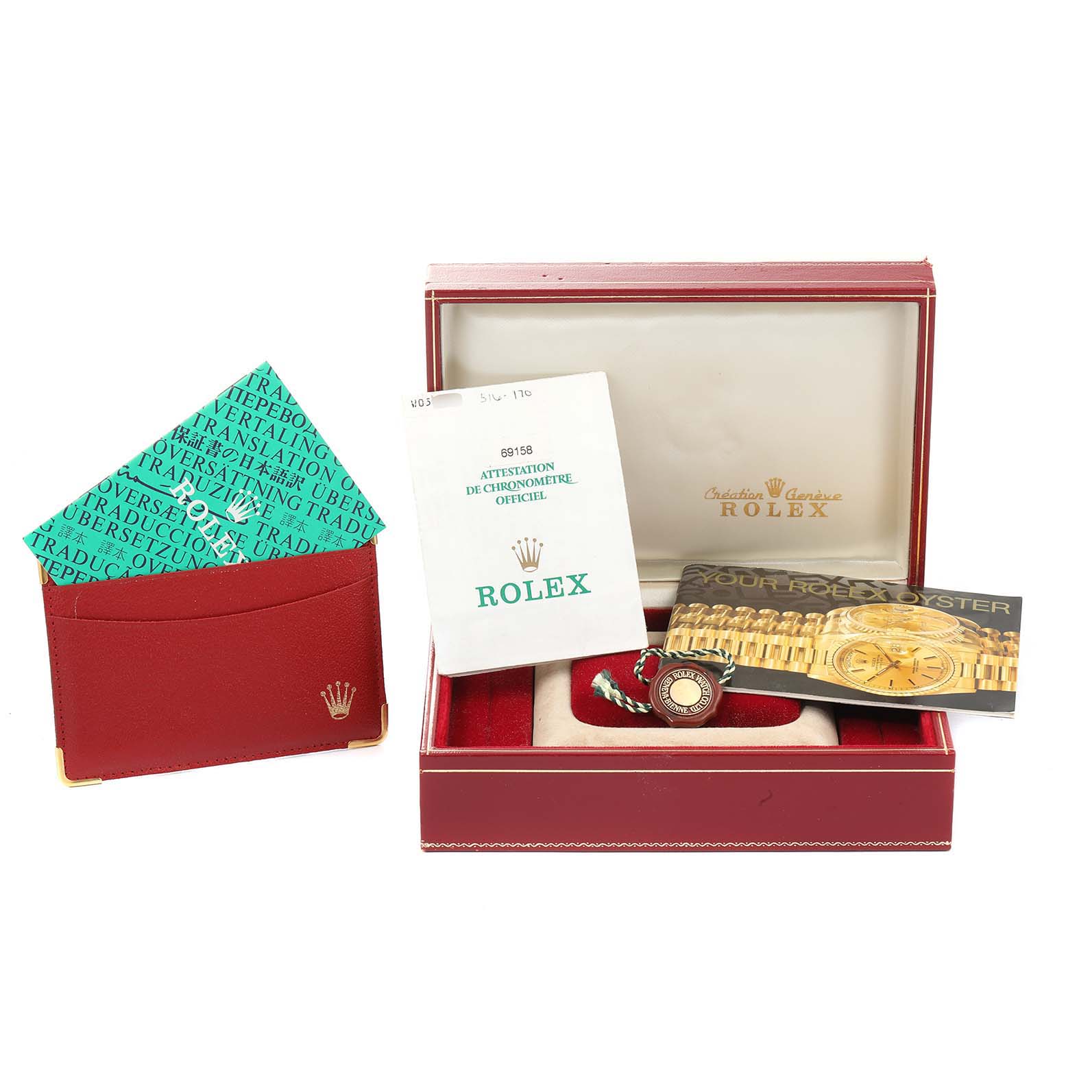 The image shows a Rolex President 69158 Women's Yellow Gold Black Dial 69158 Women's Yellow Gold Black Dial model watch with its red box, instruction manuals, and accessories from an overhead angle.