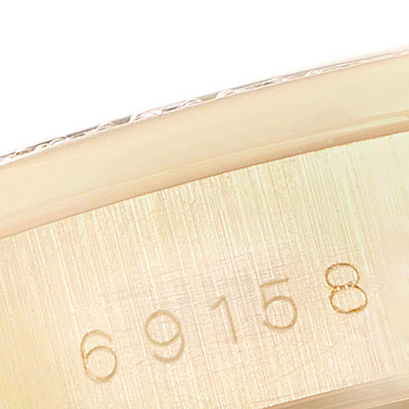 This close-up image shows the model number "69158" engraved on the inner side of a Rolex President 69158 Women's Yellow Gold Champagne Dial 69158 Women's Yellow Gold Champagne Dial watch case.