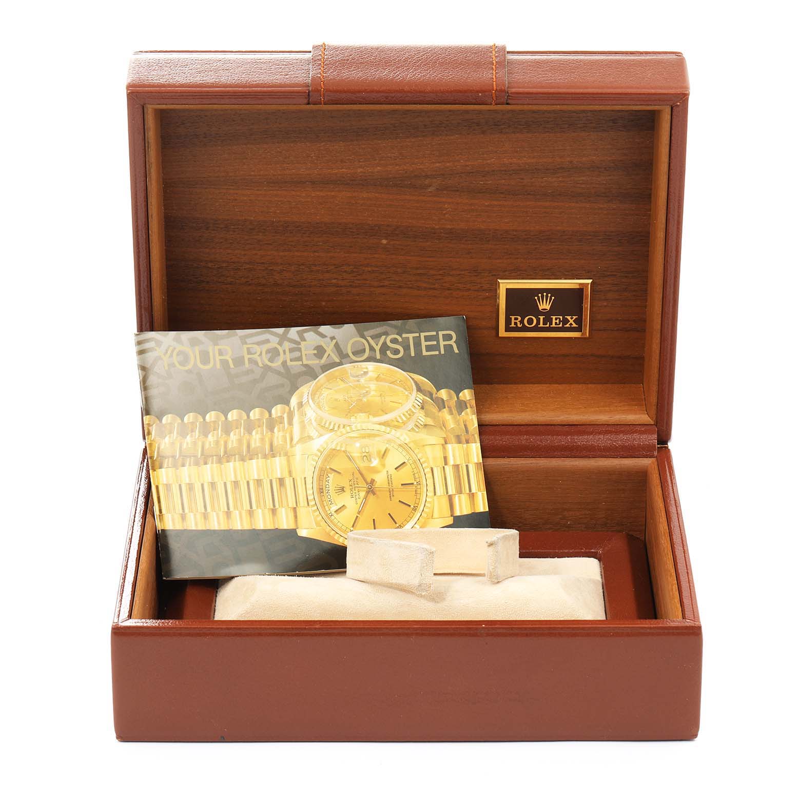 This image shows the box and booklet of a Rolex President 18038 Men's Yellow Gold Champagne Dial 18038 Men's Yellow Gold Champagne Dial model watch.