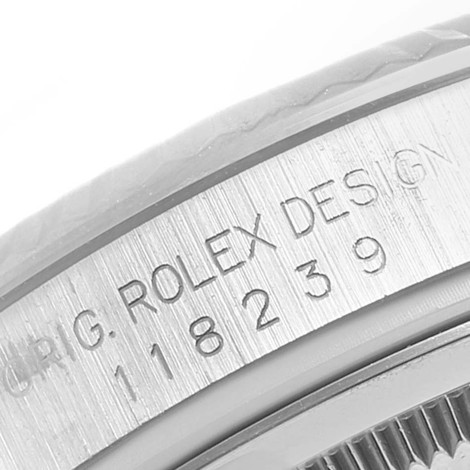 The image shows a close-up of the edge inscribed with the model number of a Rolex President 118239 Men
s White Gold Silver Dial 118239 Men
s White Gold Silver Dial watch.