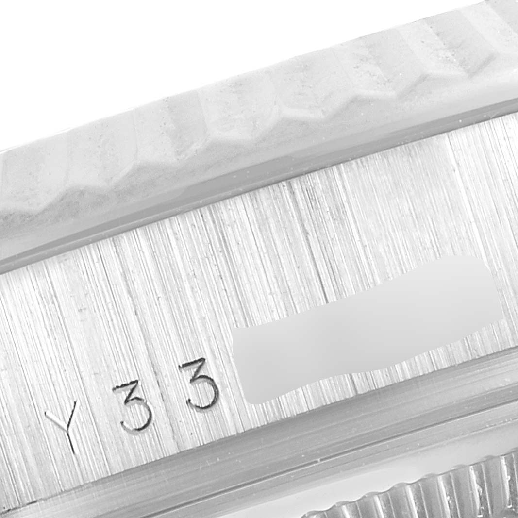 This image shows a close-up of the case side and serial number area of a Rolex President 118239 Men
s White Gold Silver Dial 118239 Men
s White Gold Silver Dial watch.