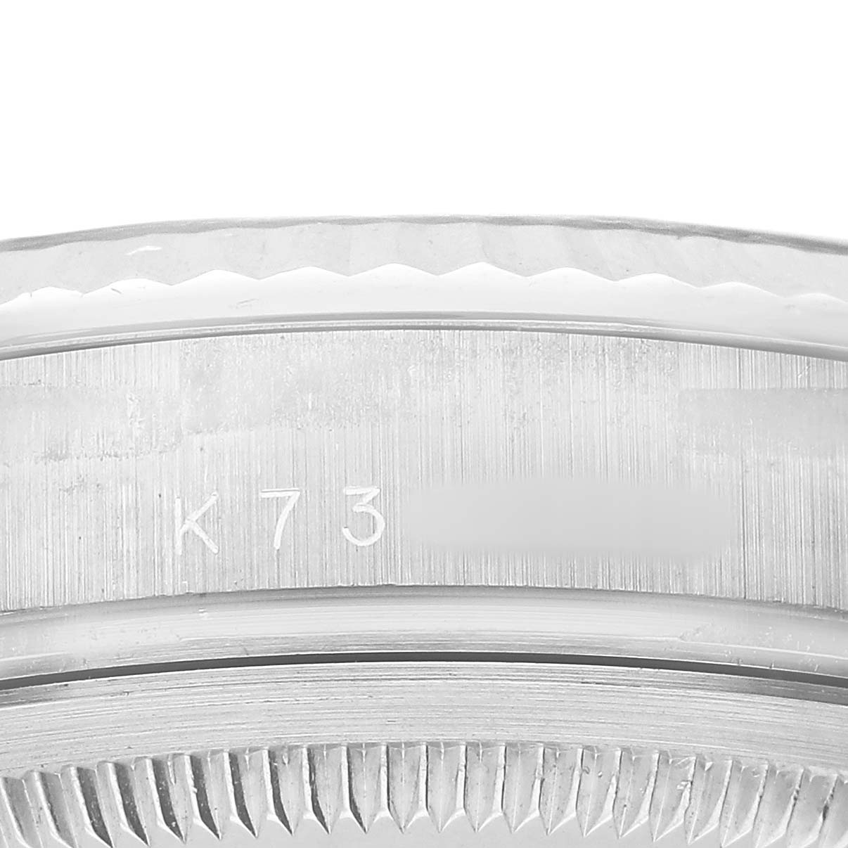 The image shows a close-up of the Rolex President 118239 Men's White Gold Silver Dial model's bezel and case edge.