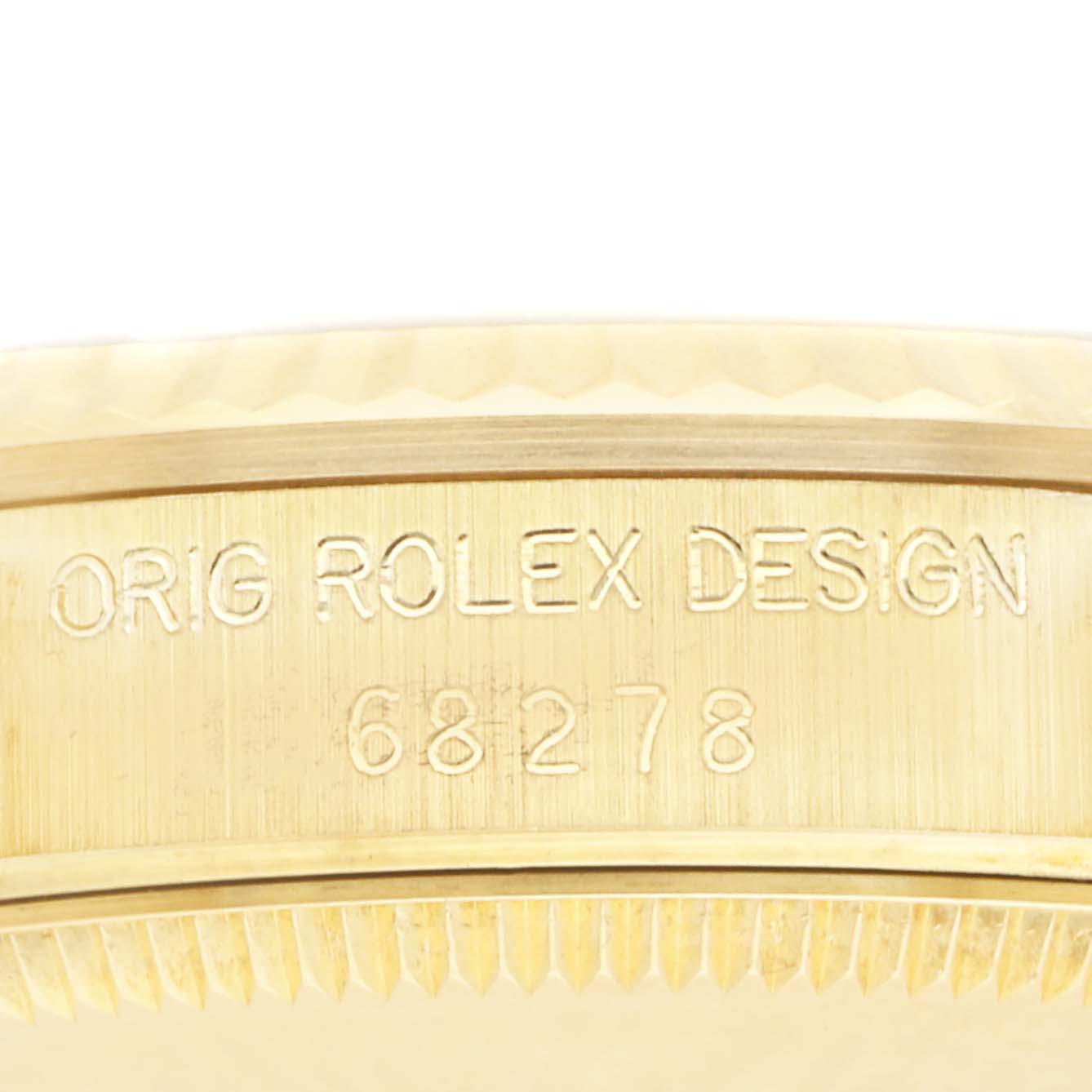 This image shows a close-up of the side of a Rolex President 68278 Women's Yellow Gold Champagne Dial 68278 Women's Yellow Gold Champagne Dial model watch case, highlighting the "ORIG ROLEX DESIGN" inscription and model number.